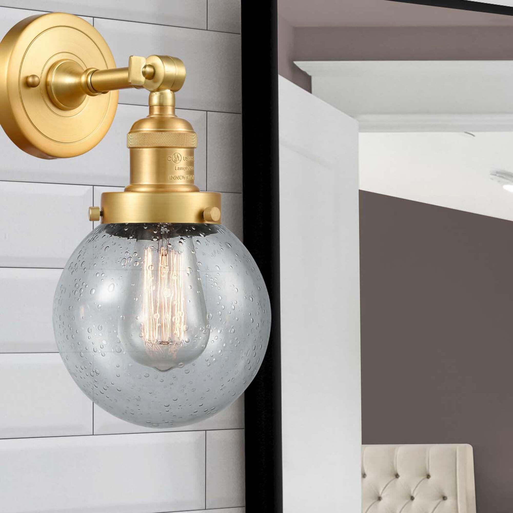 Shown in Satin Gold finish and Seedy Beacon glass