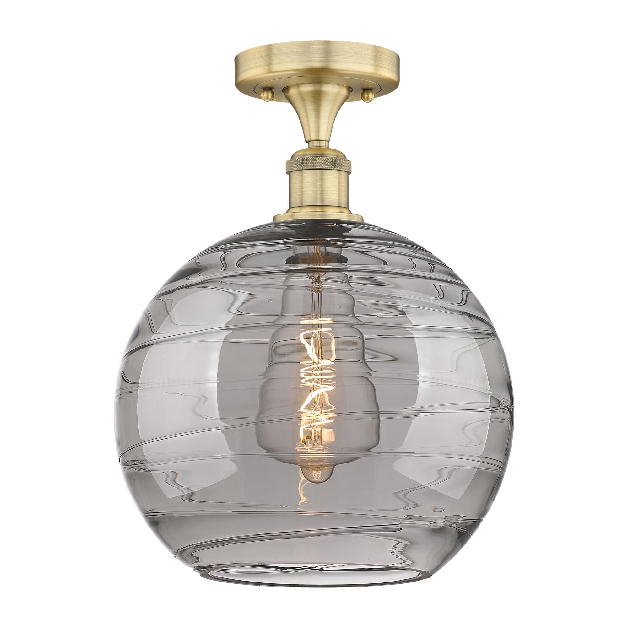 Shown in Brushed Brass finish and Light Smoke Deco Swirl glass