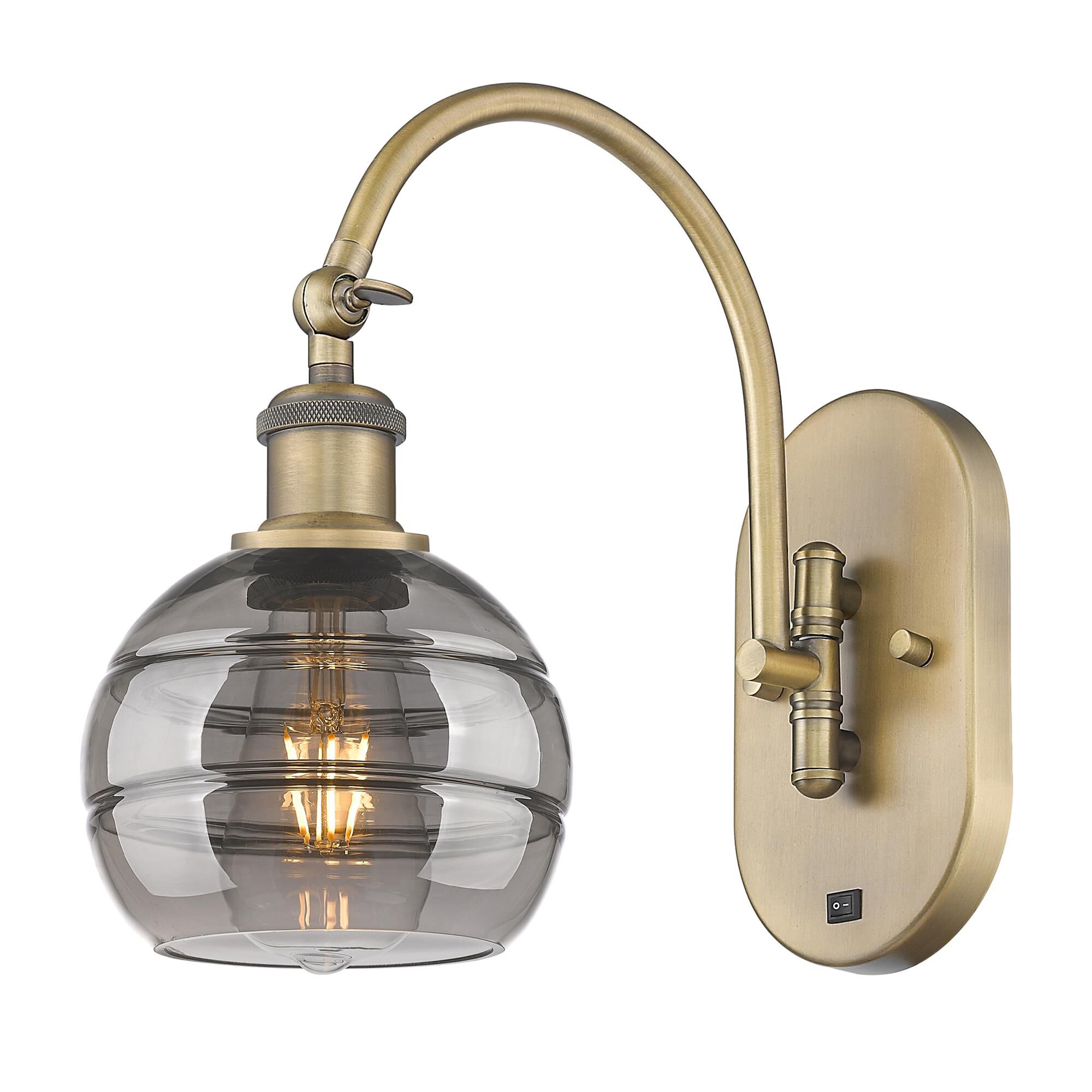 Shown in Brushed Brass finish and Light Smoke glass