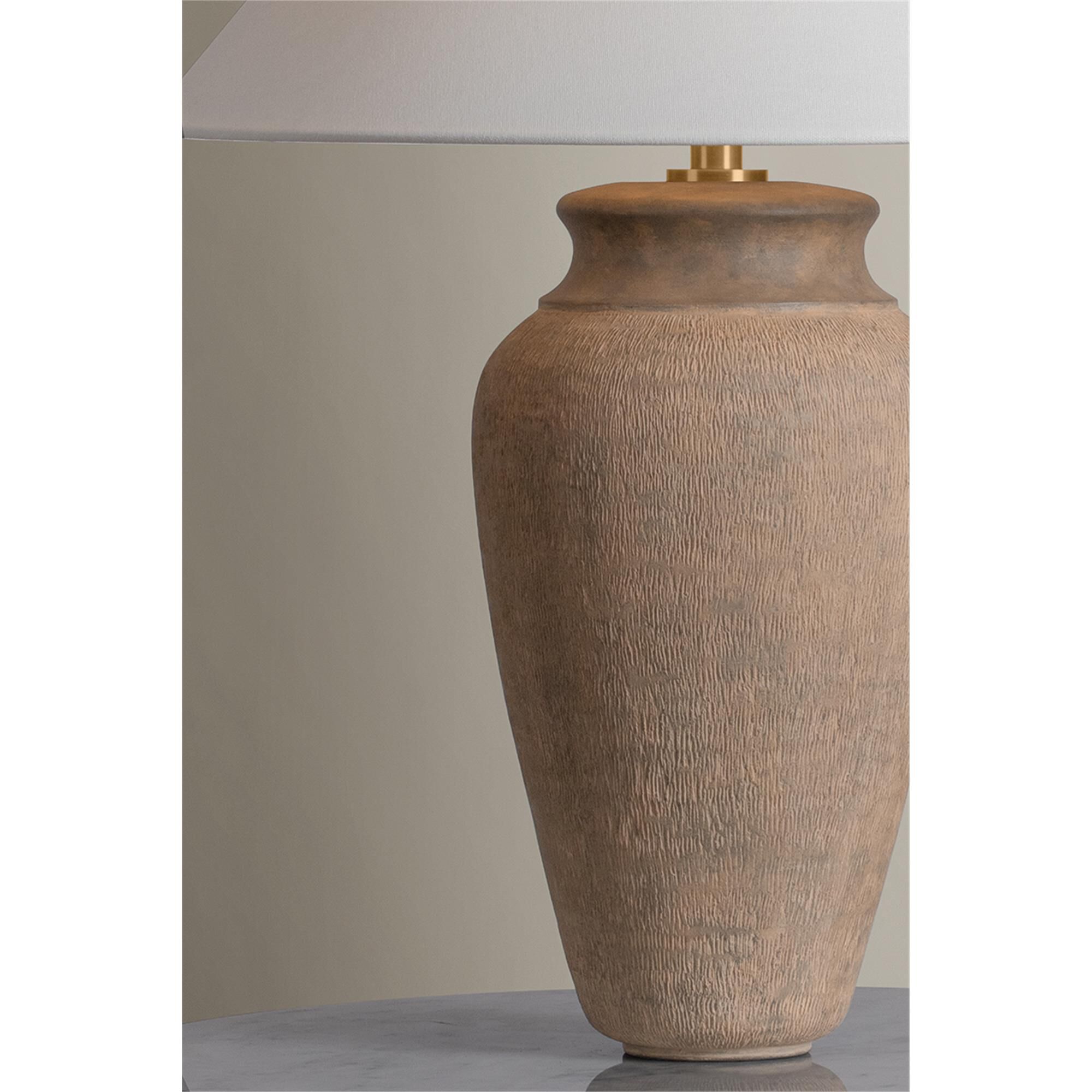 Shown in Patina Brass and Ceramic Textural Umber finish and Off White Linen shade
