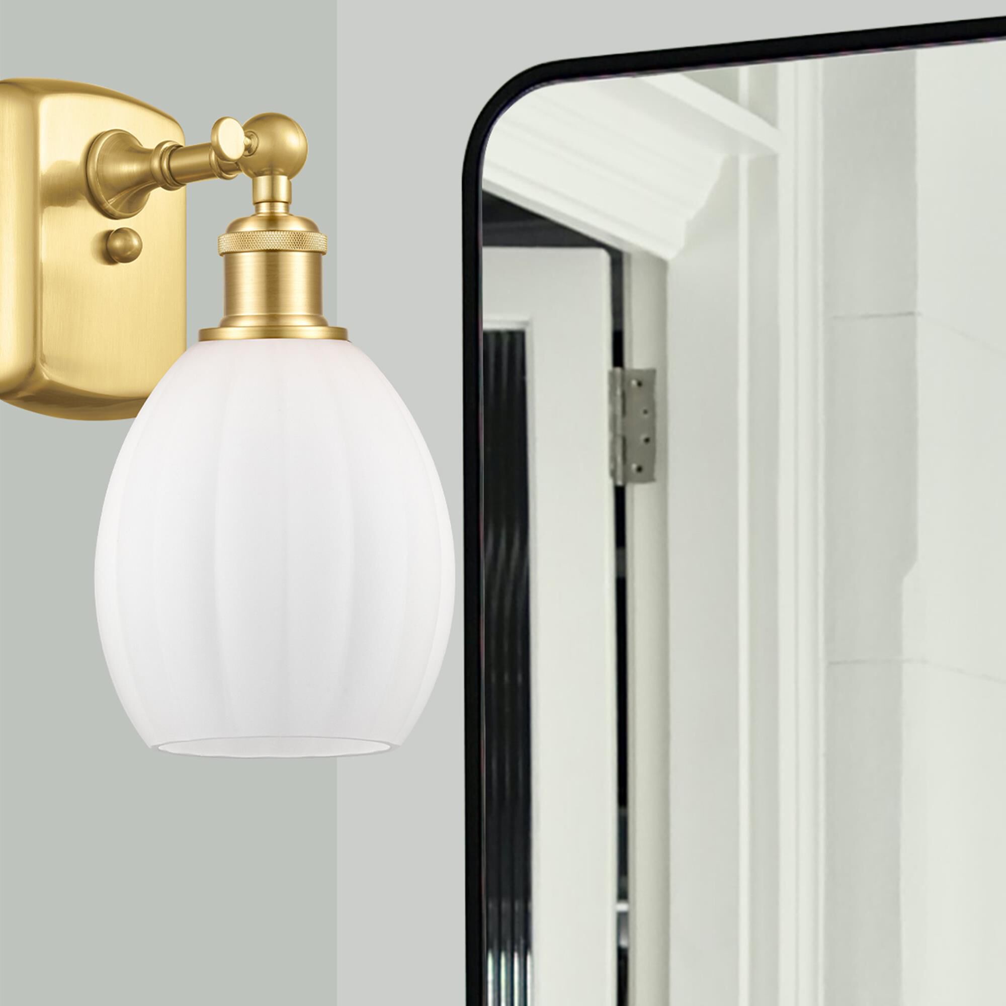 Shown in Satin Gold finish and Matte White Eaton glass