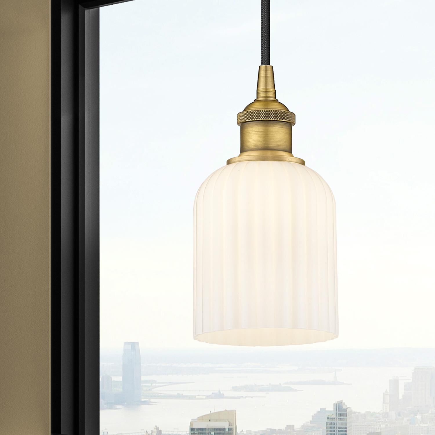 Shown in Brushed Brass finish and Gloss White glass