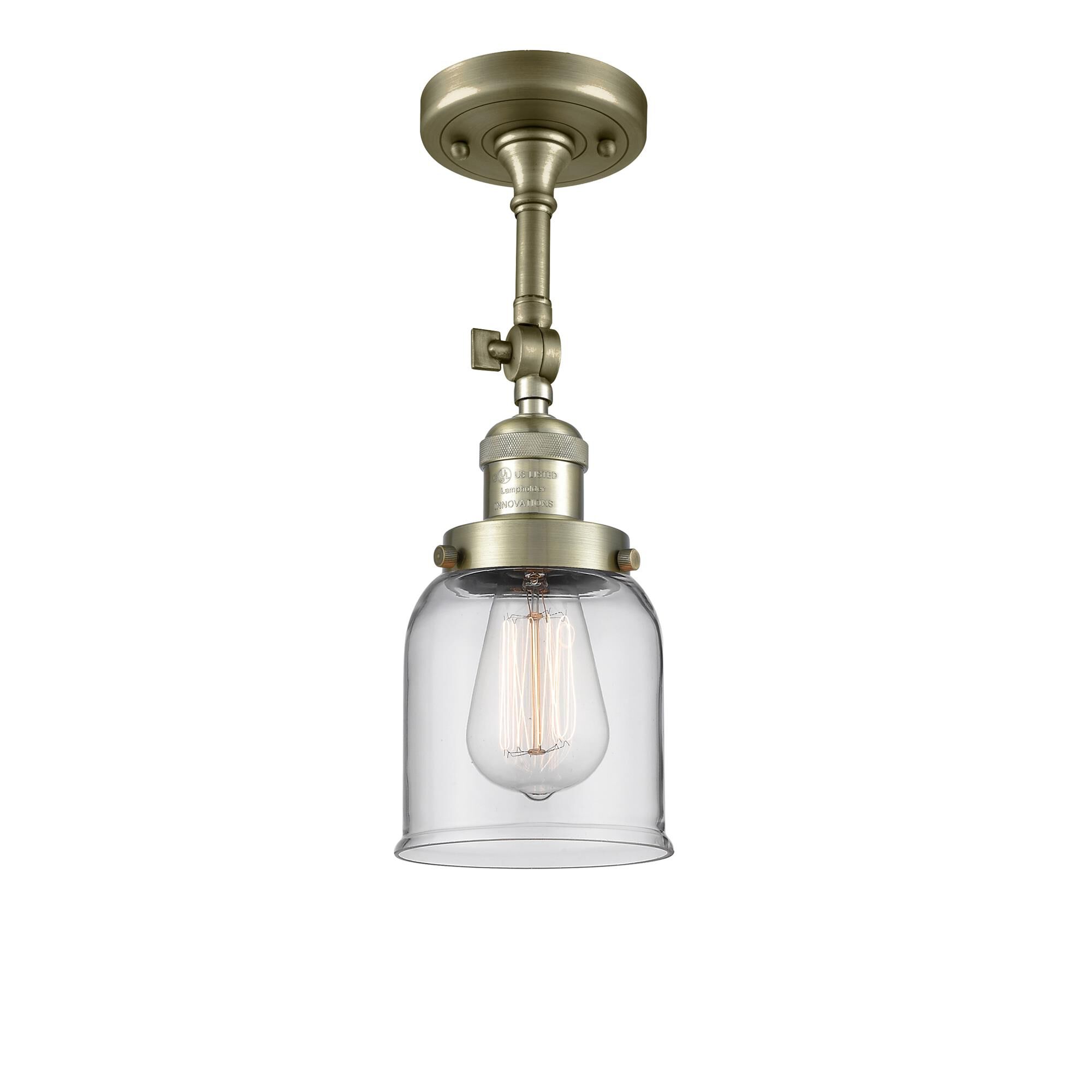 Shown in Antique Brass finish and Clear glass