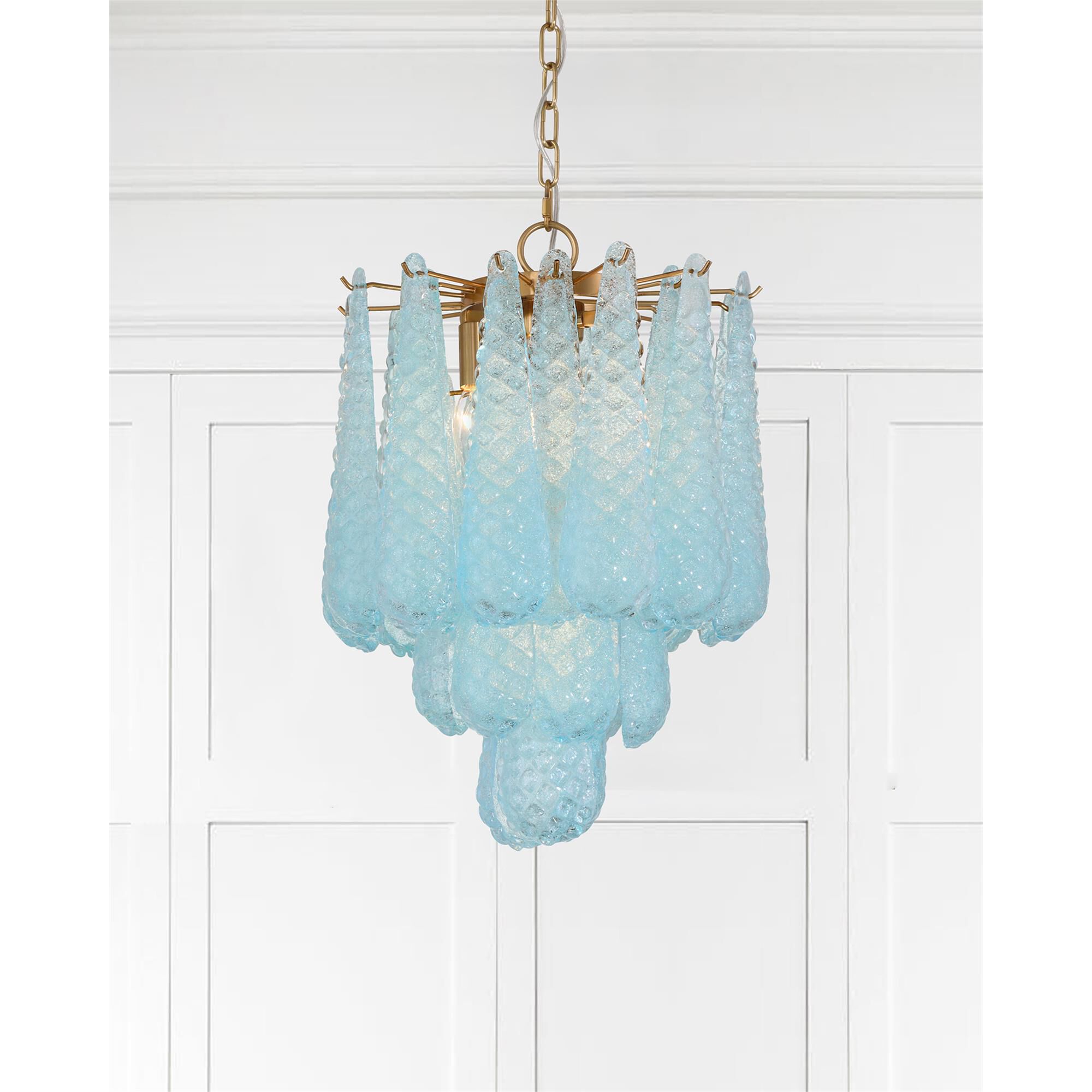 Shown in Aged Brass finish and Sand Blue glass