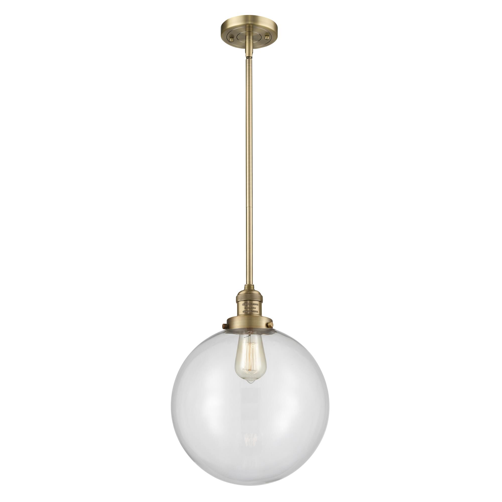 Shown in Brushed Brass finish and Clear Beacon glass