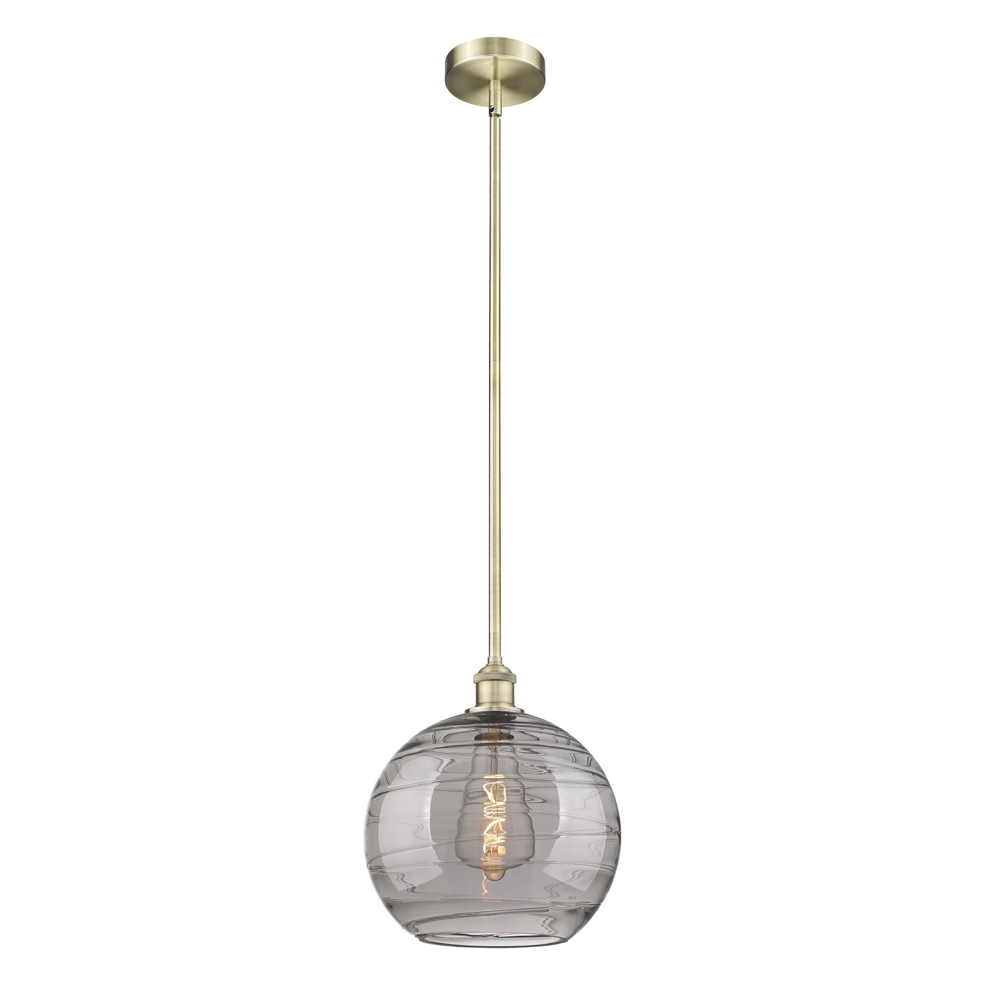 Shown in Antique Brass finish and Light Smoke Deco Swirl glass
