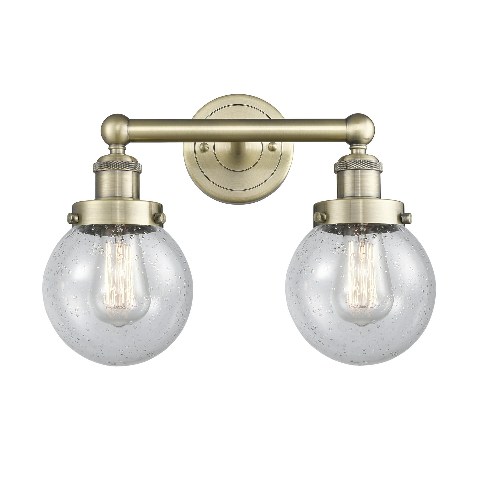 Shown in Antique Brass finish and Seedy glass