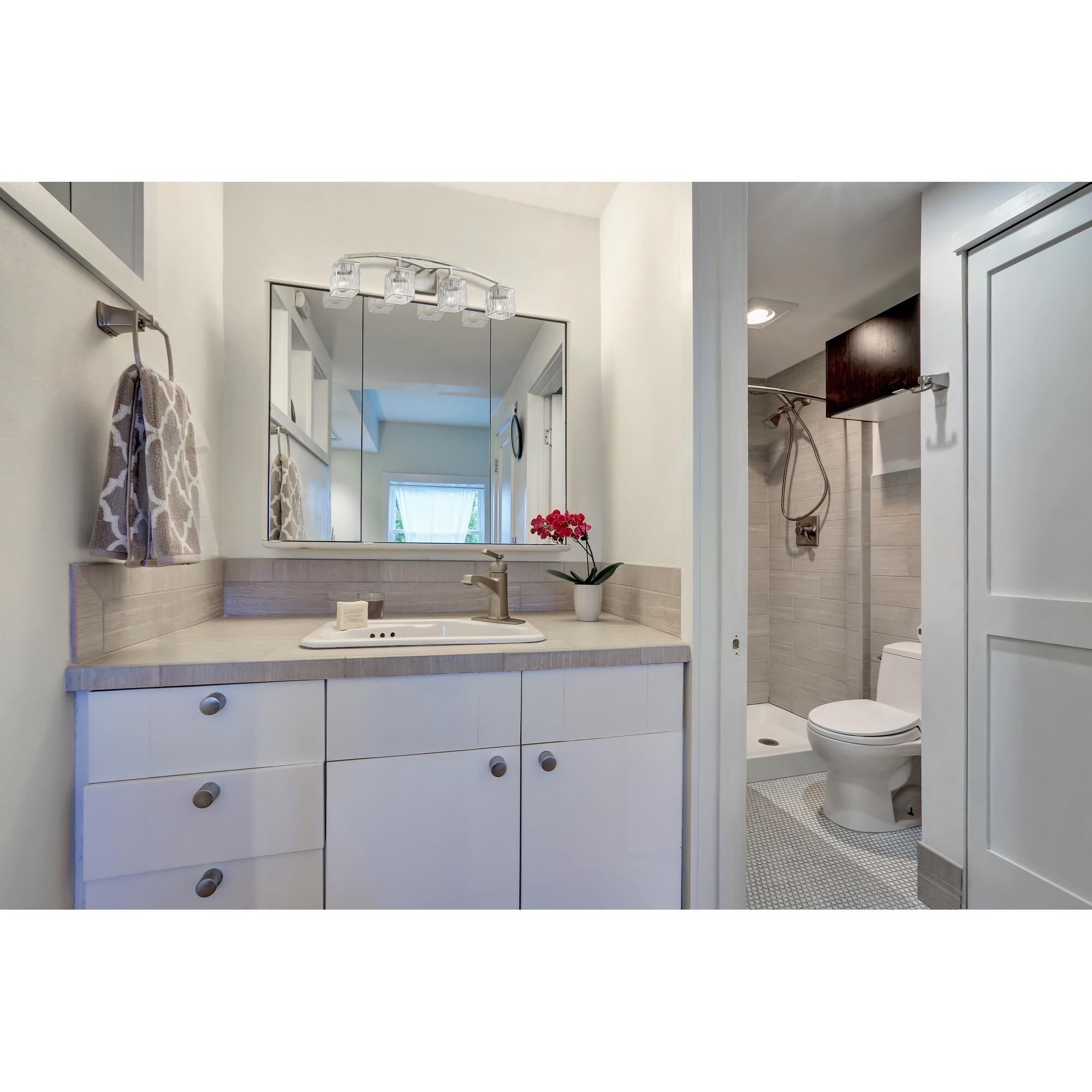 Shown in Brushed Nickel finish and Glass shade