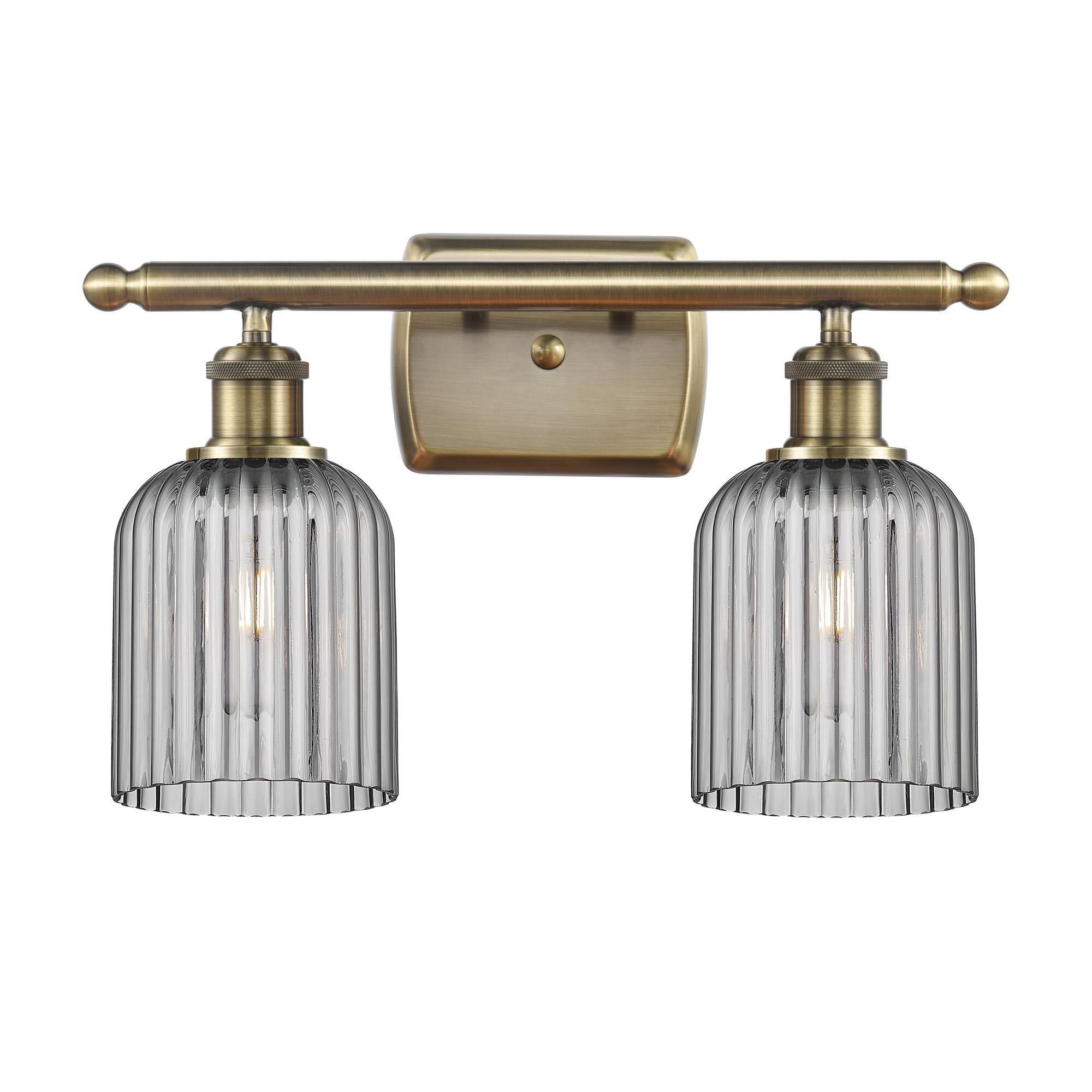 Shown in Antique Brass finish and Light Smoke shade