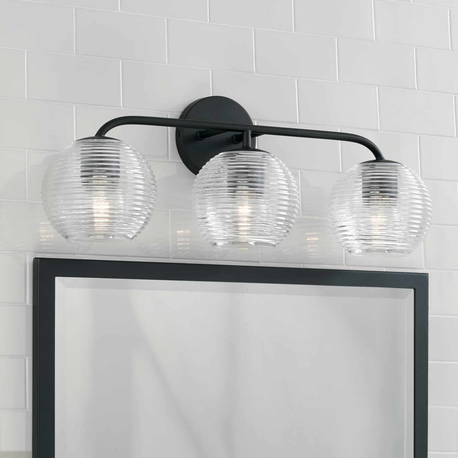 Shown in Matte Black finish and Clear Ribbed glass