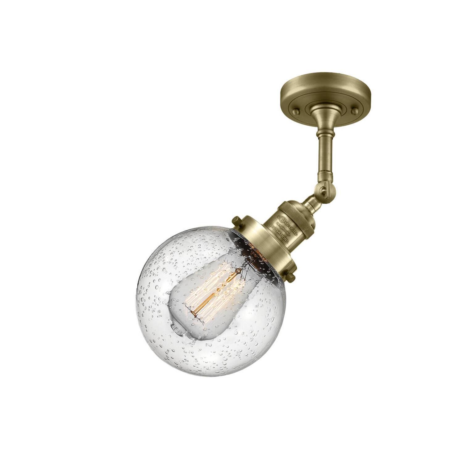 Shown in Antique Brass finish and Seedy glass and No Accent accent