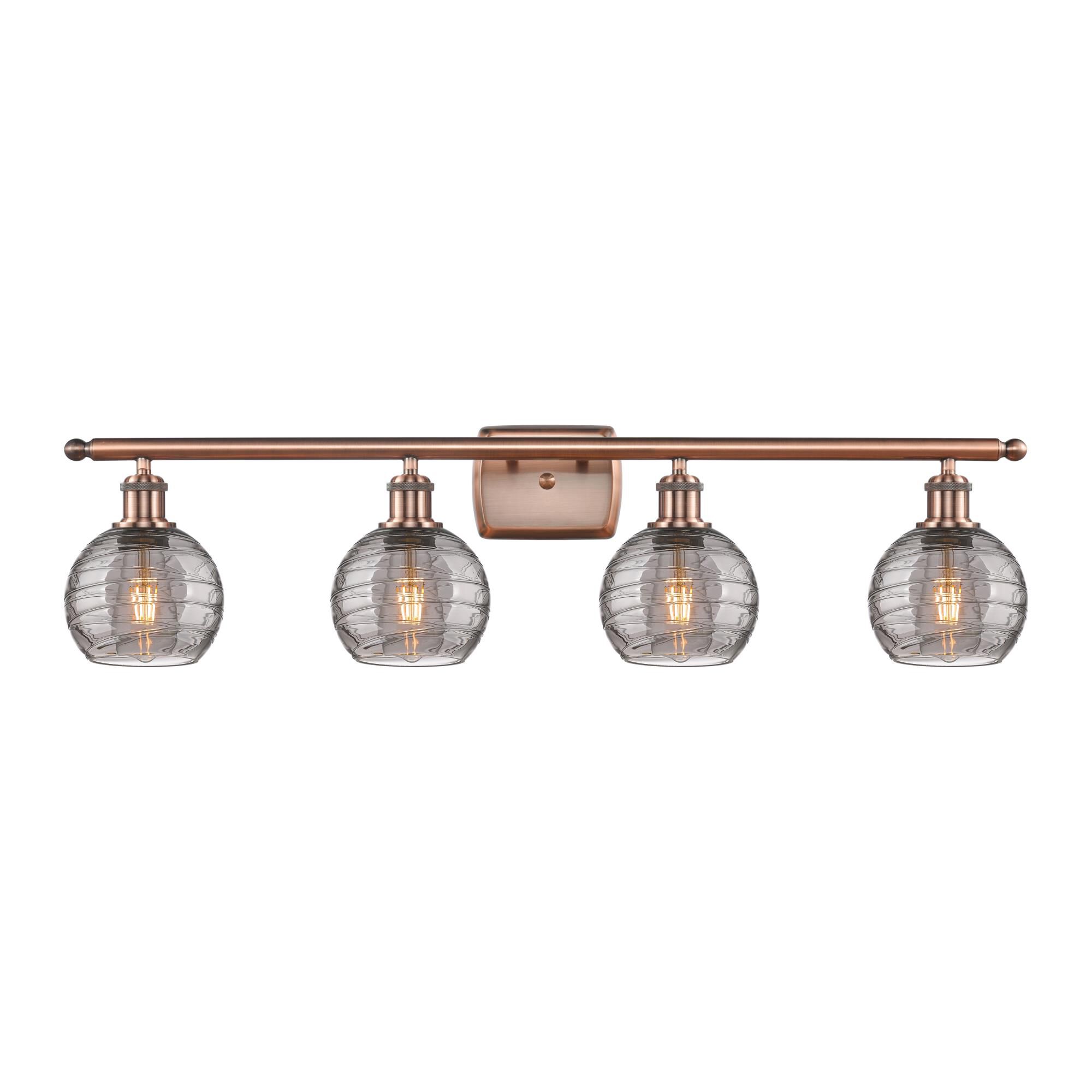 Shown in Antique Copper finish and Light Smoke Deco Swirl glass
