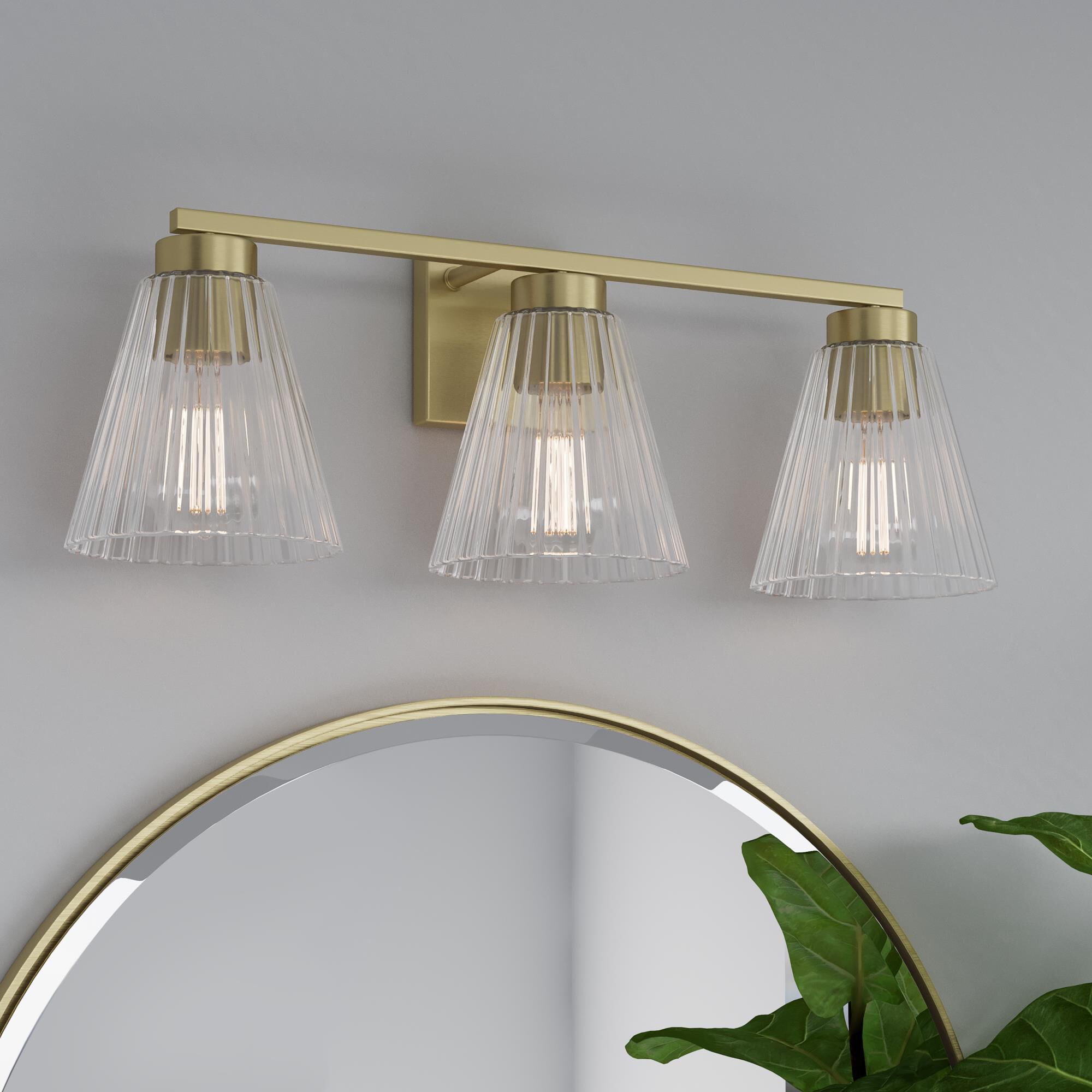 Shown in Vintage Brass finish and Clear Striated glass