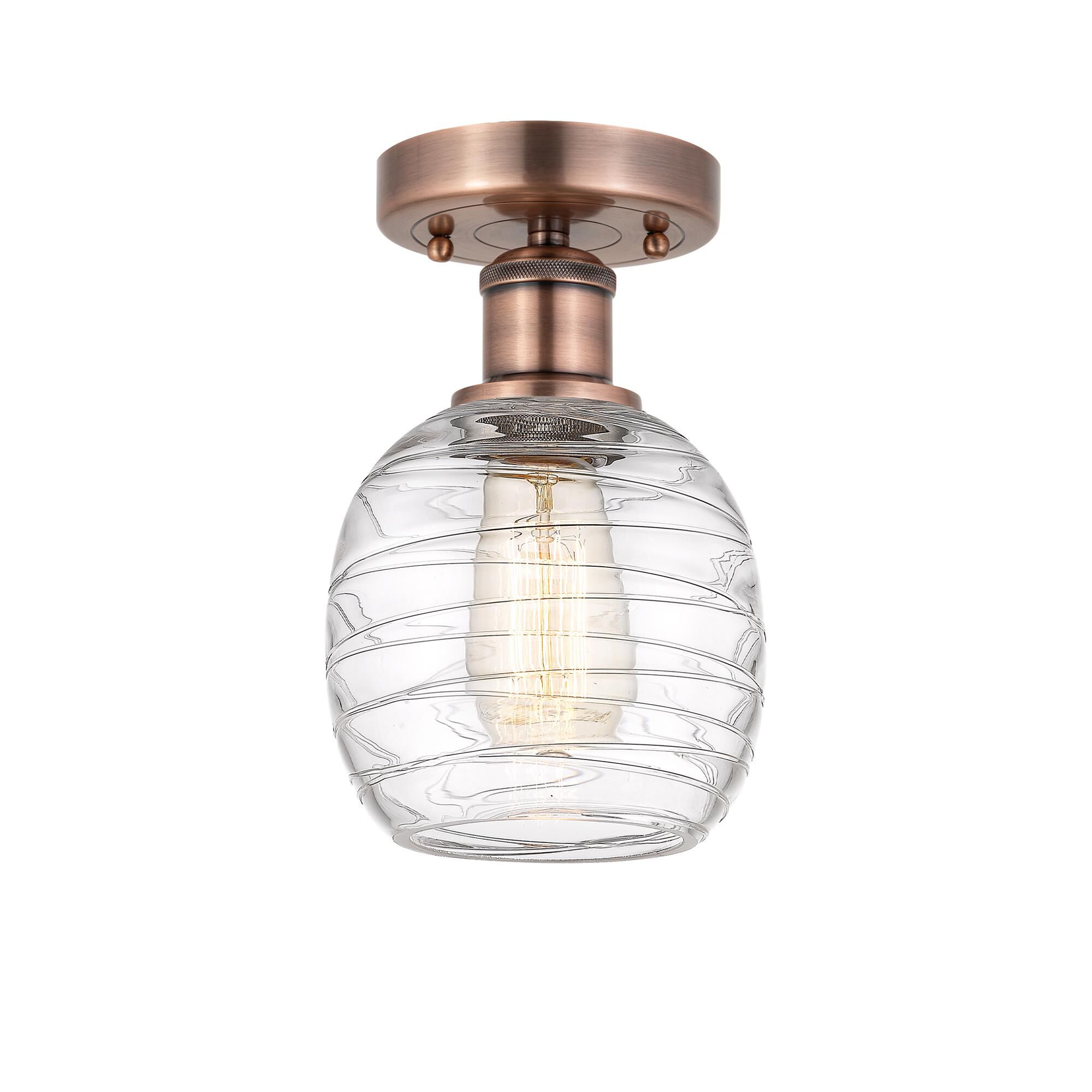 Shown in Antique Copper finish and Deco Swirl glass