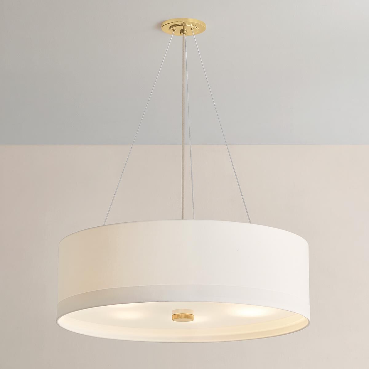 Shown in Aged Brass finish and White Linen shade