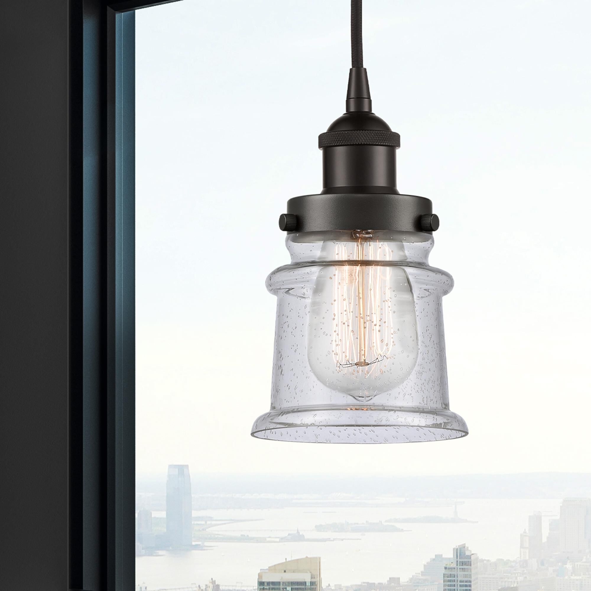 Shown in Oil Rubbed Bronze finish and Seedy glass