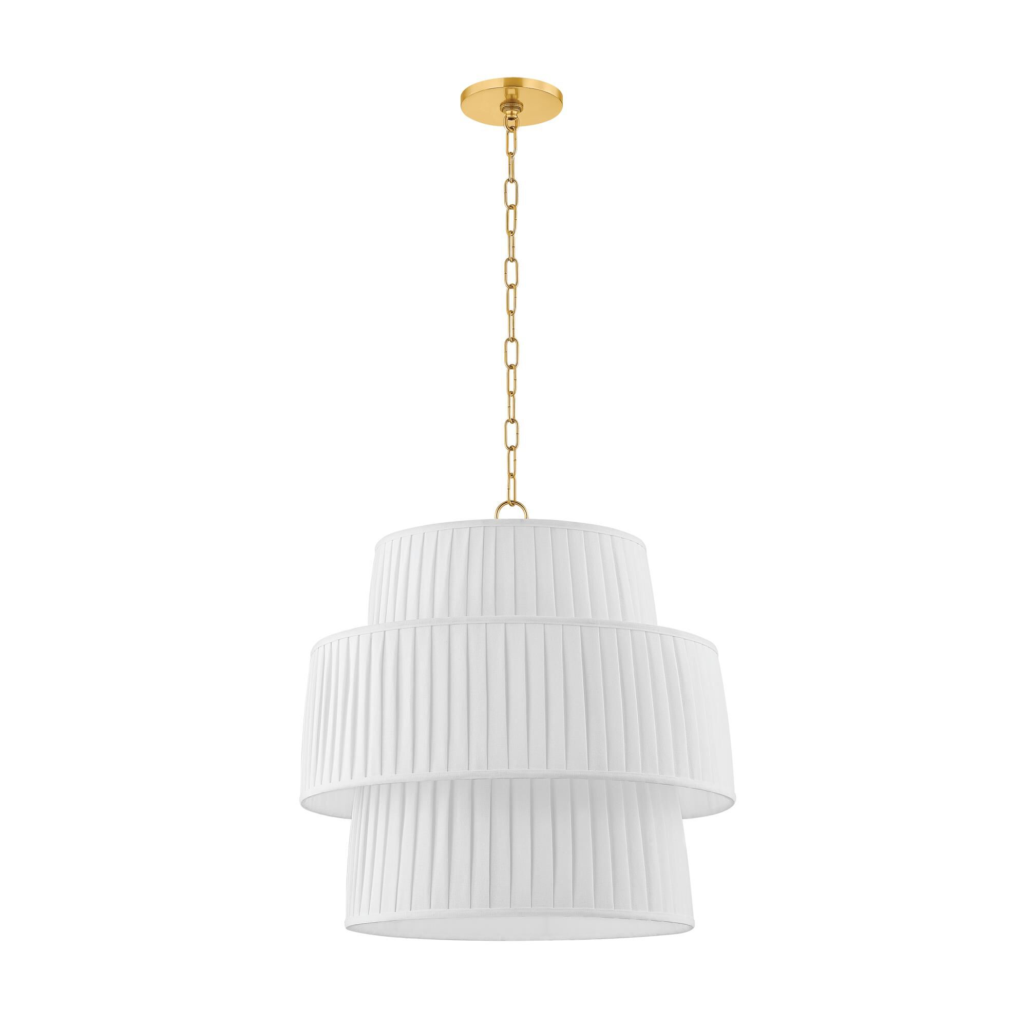 Shown in Aged Brass finish and White Linen shade