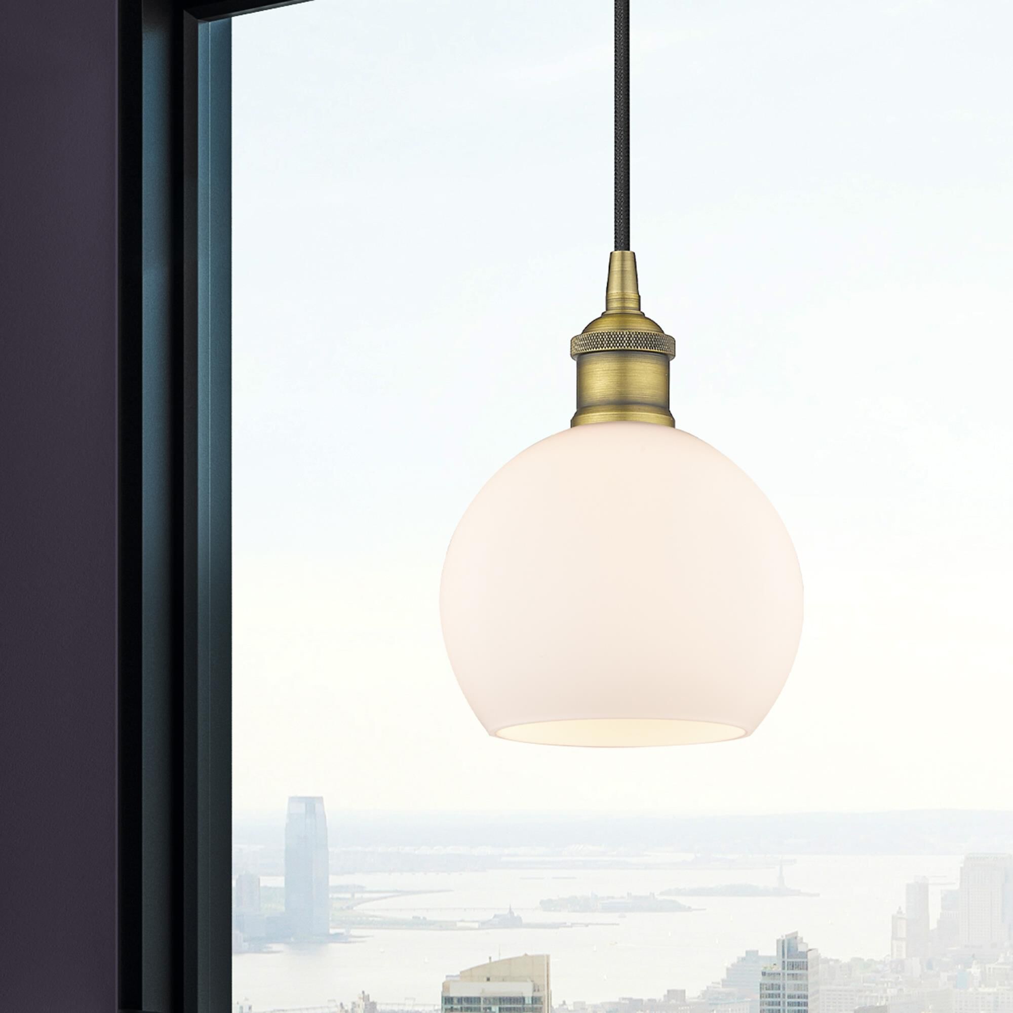 Shown in Brushed Brass finish and Cased Matte White glass