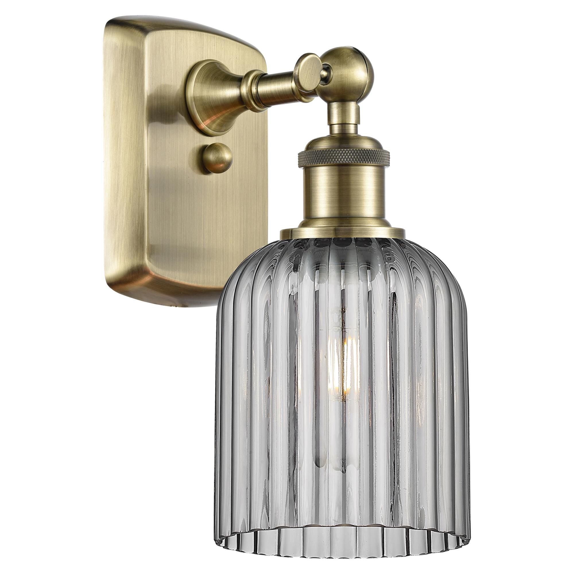 Shown in Antique Brass finish and Light Smoke shade