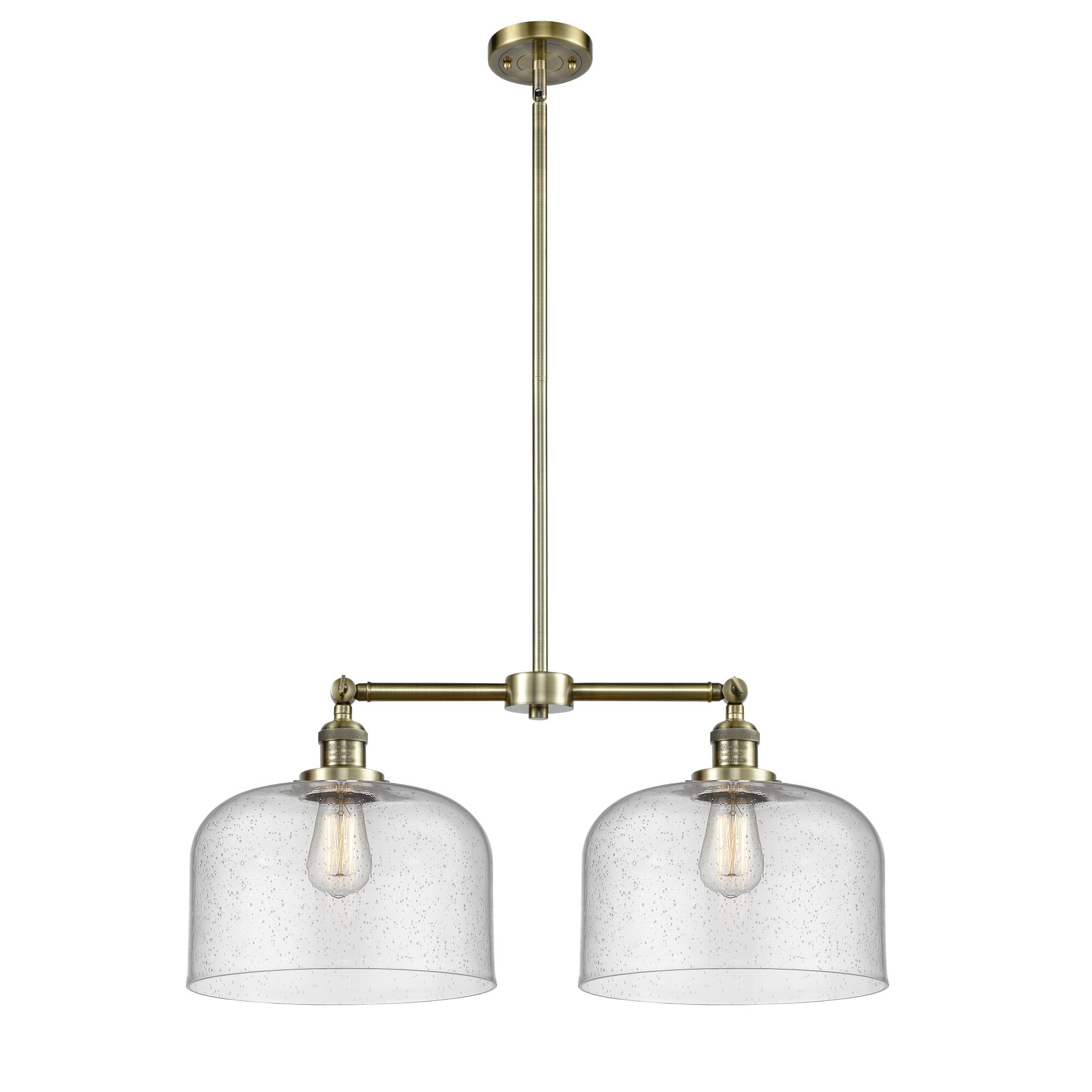 Shown in Antique Brass finish and Seedy glass