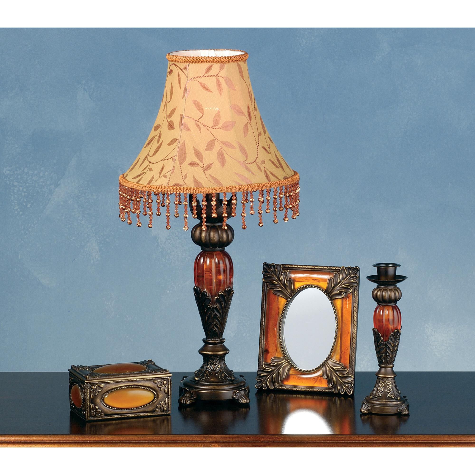 Shown in Antique Bronze-Amber finish and Saffron Leaf Patterned Fabric shade