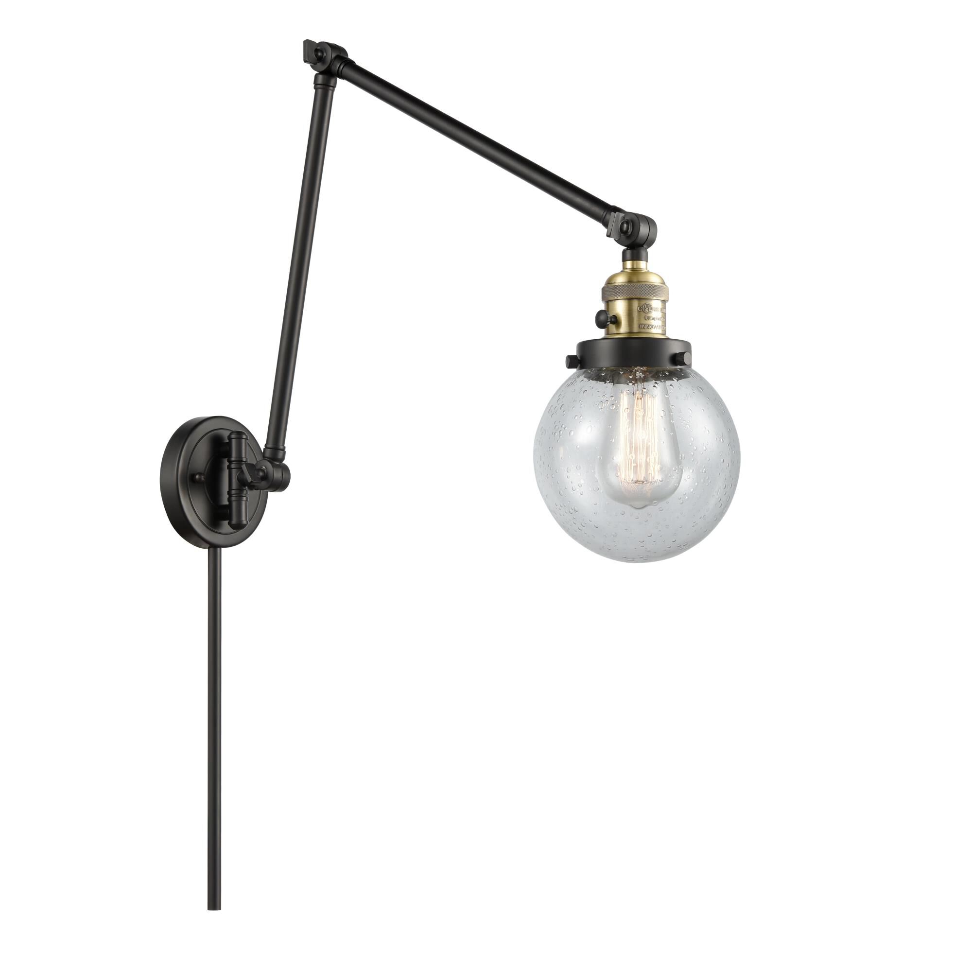 Shown in Black Antique Brass finish and Seedy Beacon glass