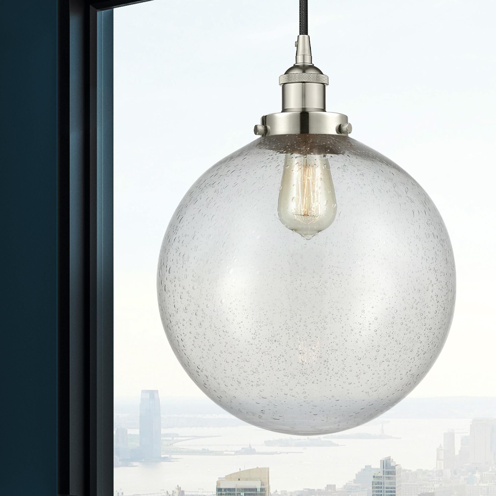 Shown in Polished Nickel finish and Seedy Beacon glass