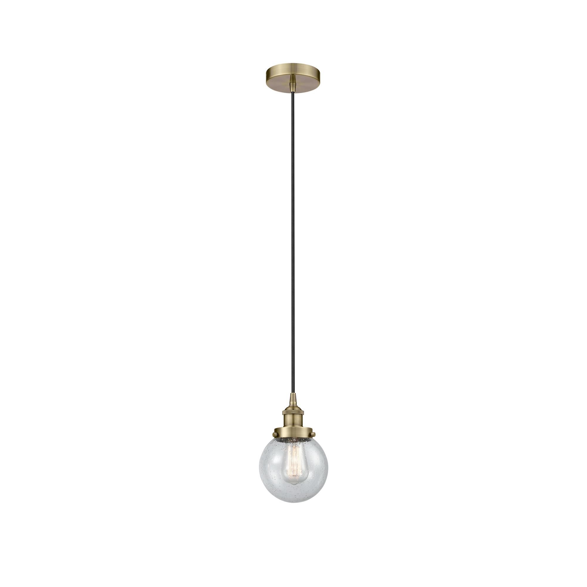 Shown in Antique Brass finish and Seedy glass