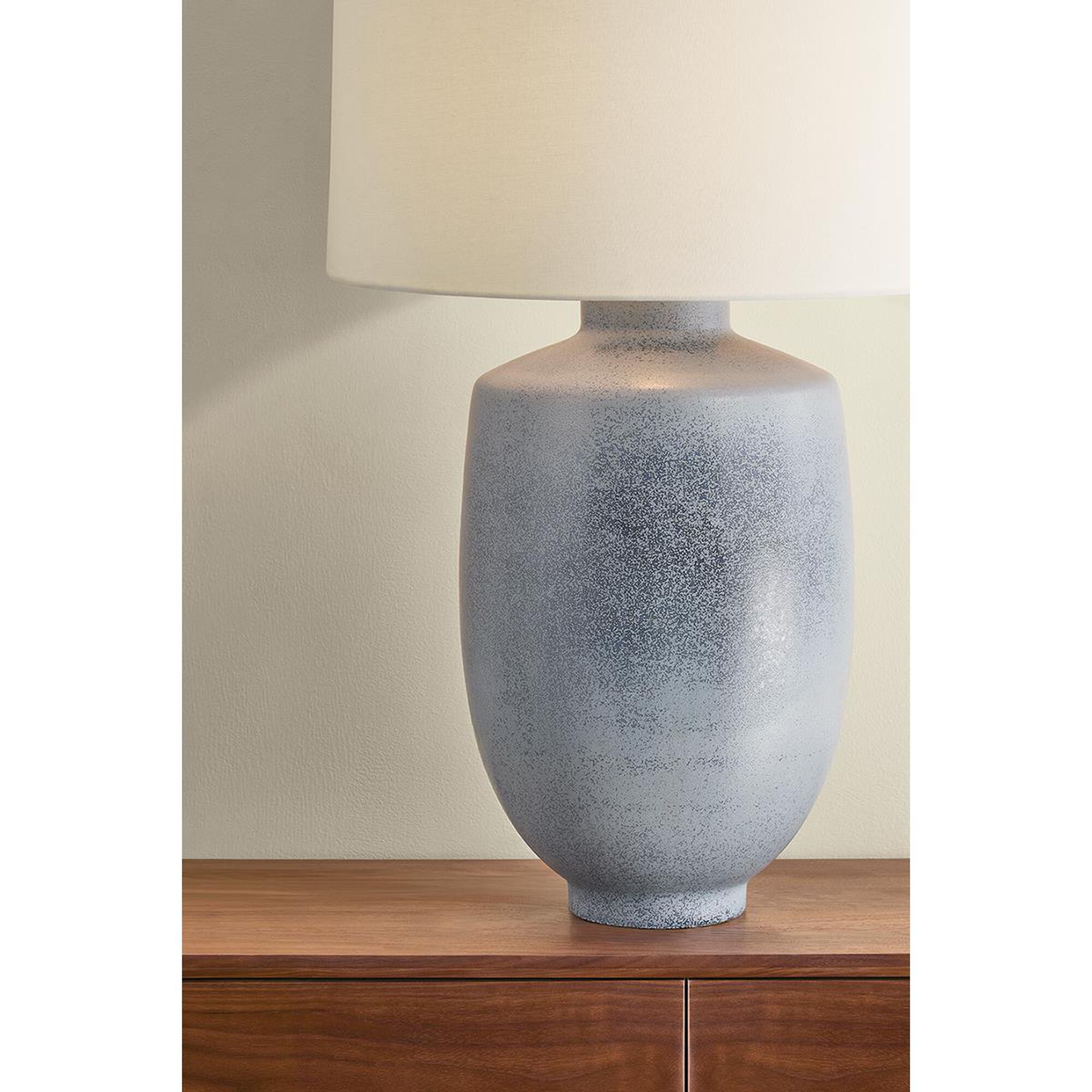 Shown in Aged Brass and Ceramic Oceanside finish and White Linen shade
