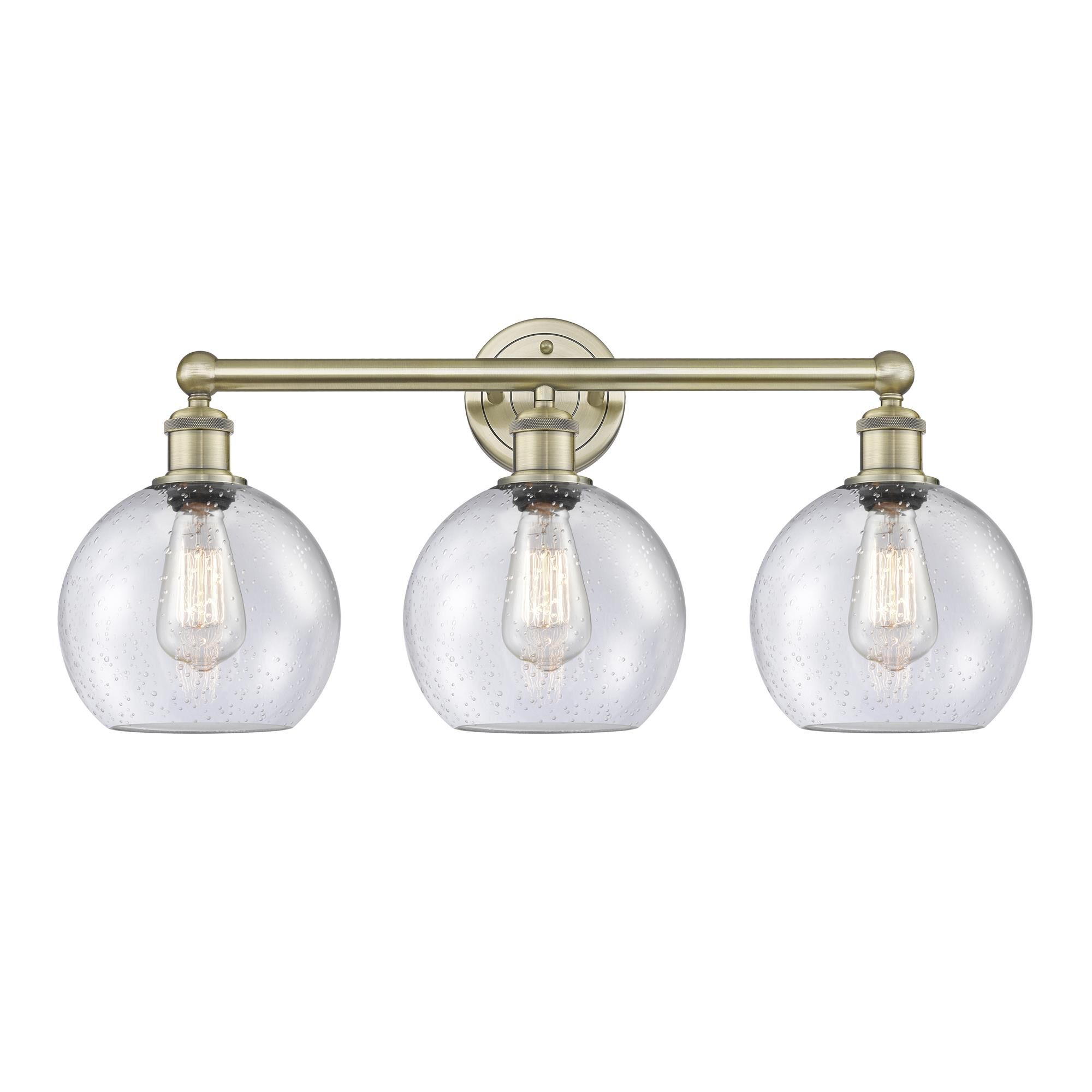 Shown in Antique Brass finish and Seedy glass