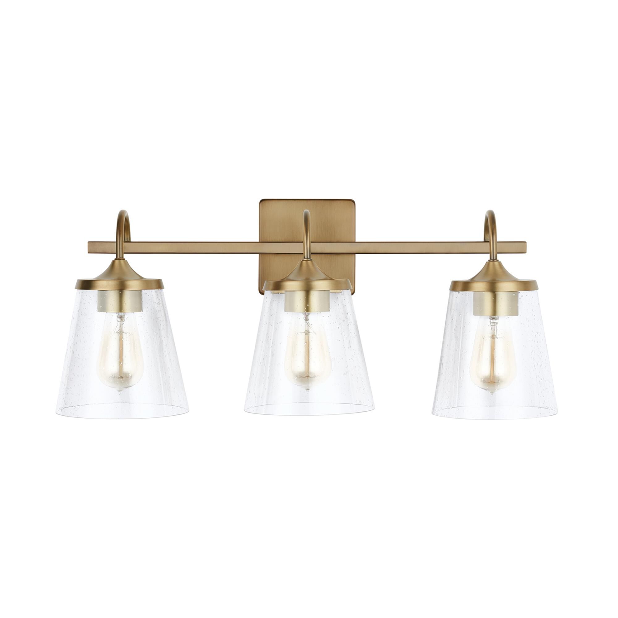 Shown in Aged Brass finish and Clear Seeded glass