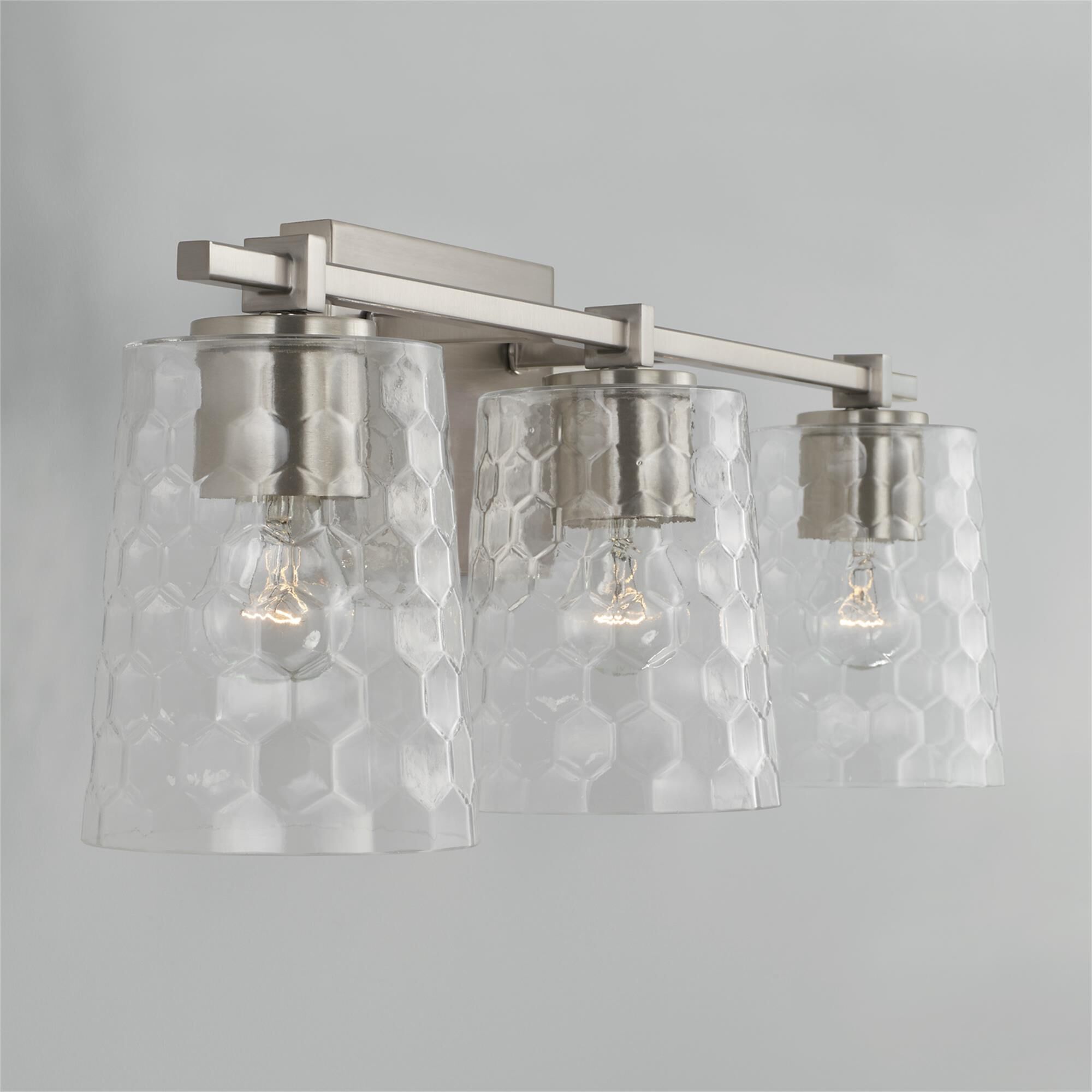 Shown in Brushed Nickel finish and Clear Honeycomb glass