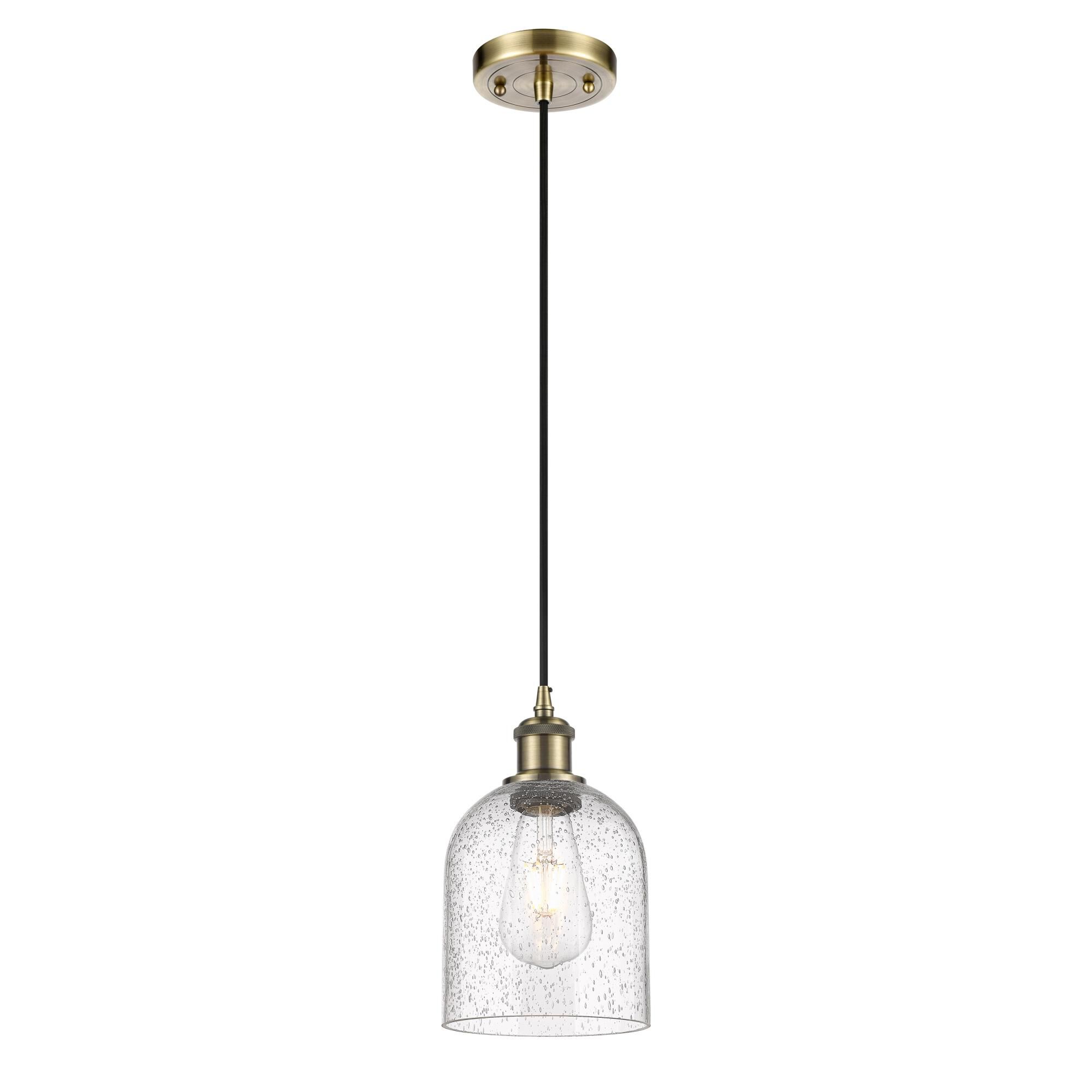 Shown in Antique Brass finish and Seedy glass