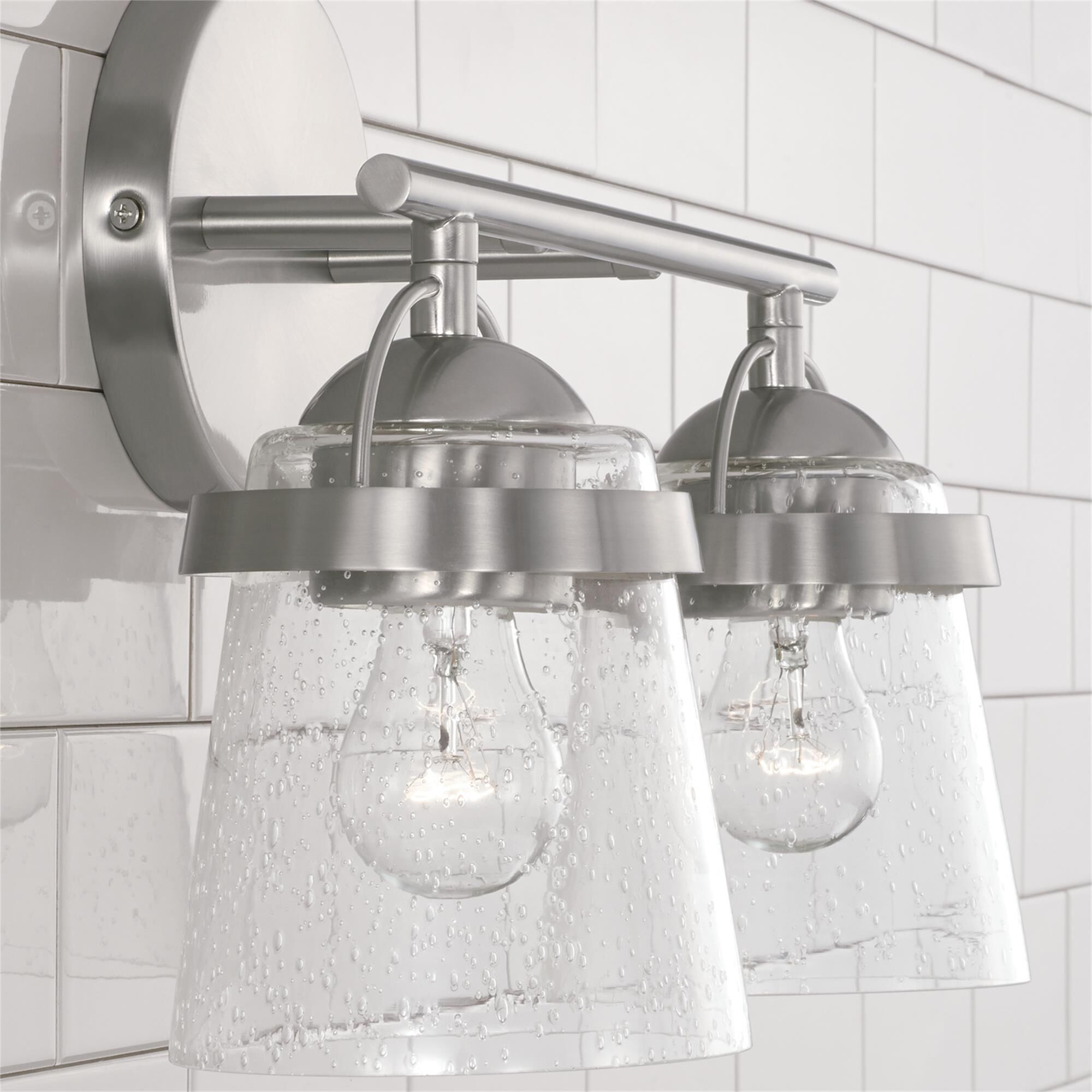 Shown in Brushed Nickel finish and Clear Seeded glass