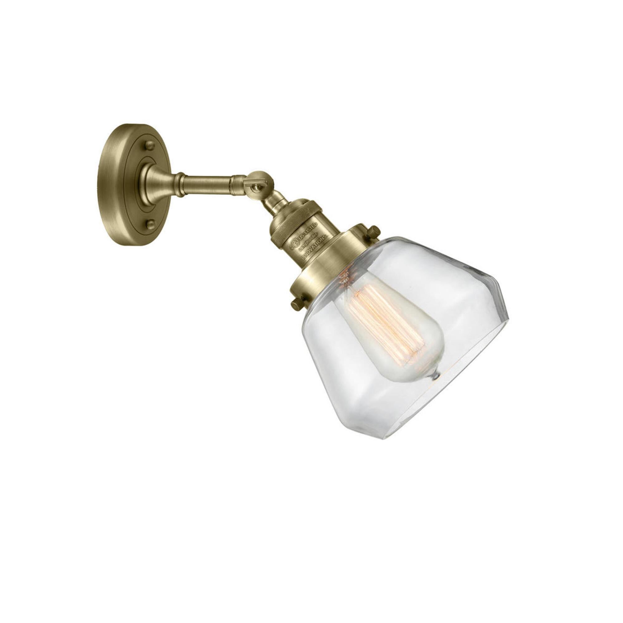 Shown in Antique Brass finish and Clear glass and None accent