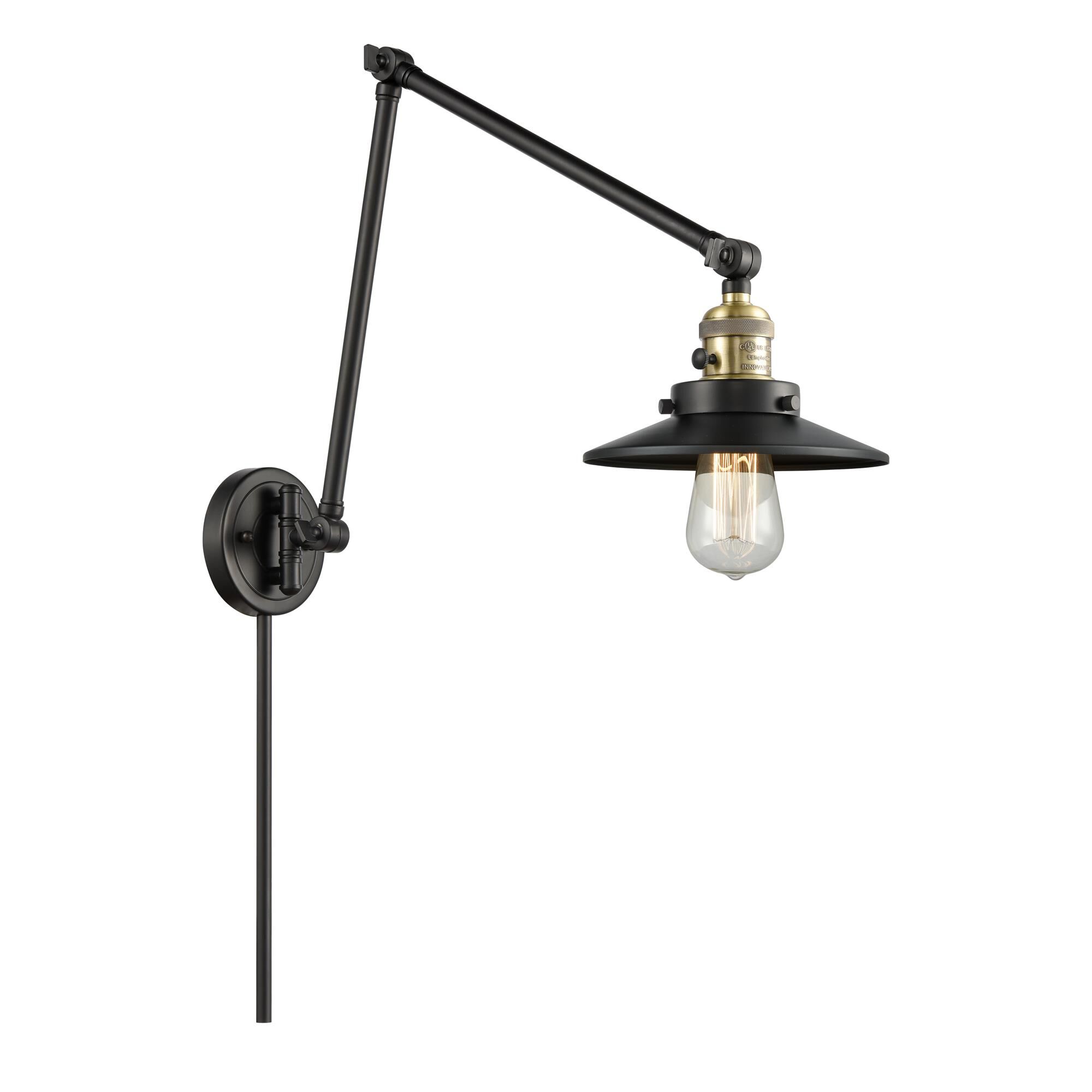 Shown in Black Antique Brass finish and Matte Black Railroad shade