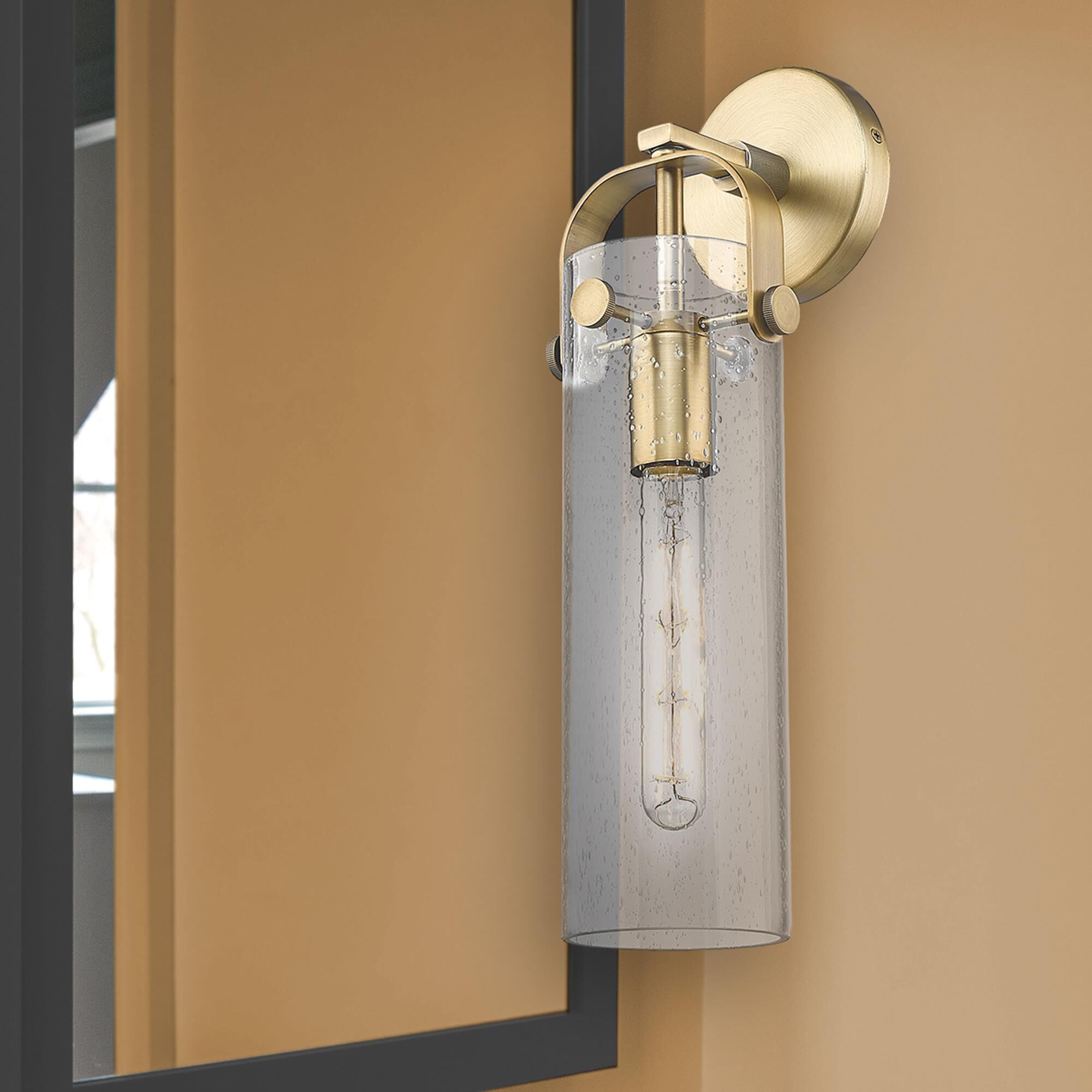 Shown in Brushed Brass finish and Seedy glass