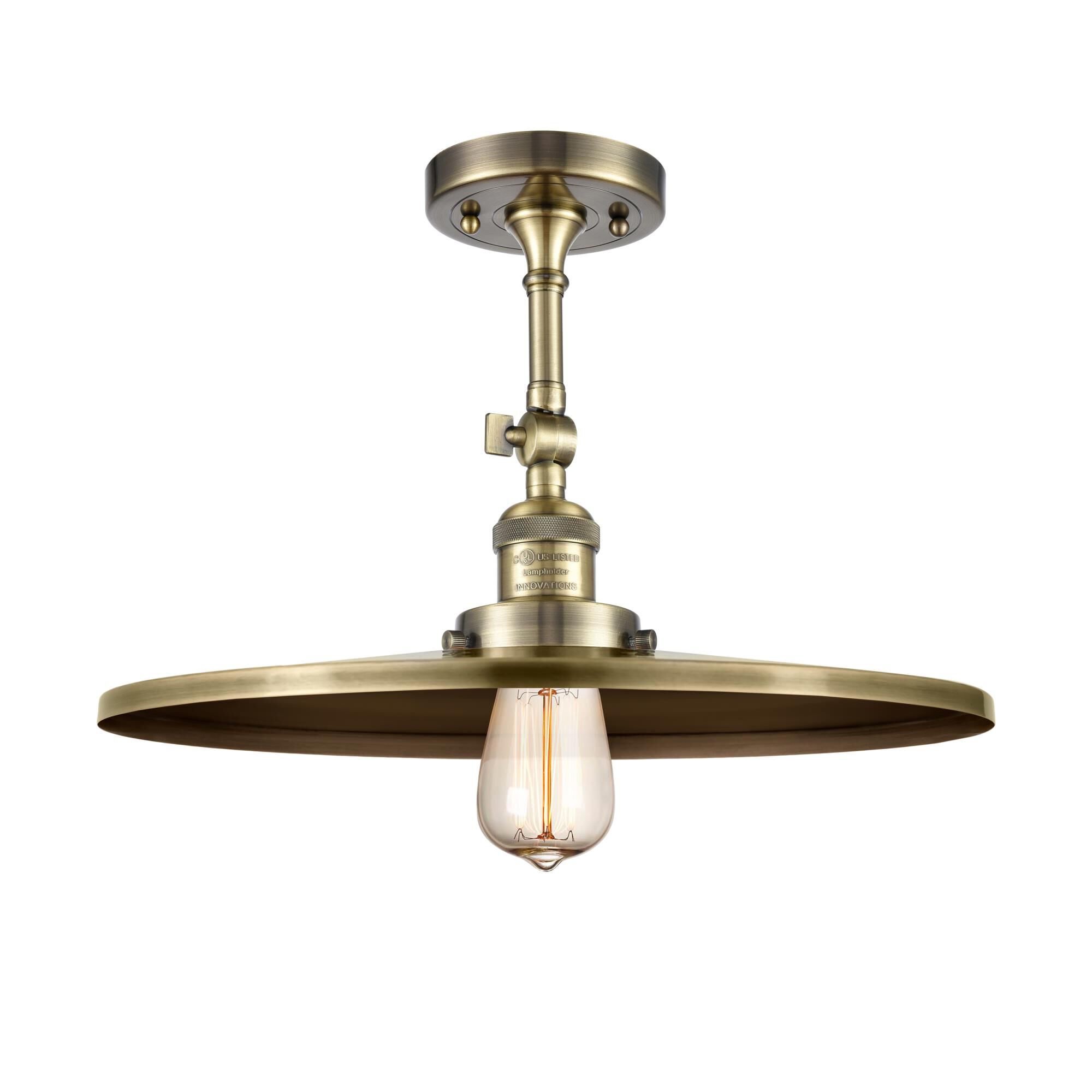 Shown in Antique Brass finish and Antique Brass shade