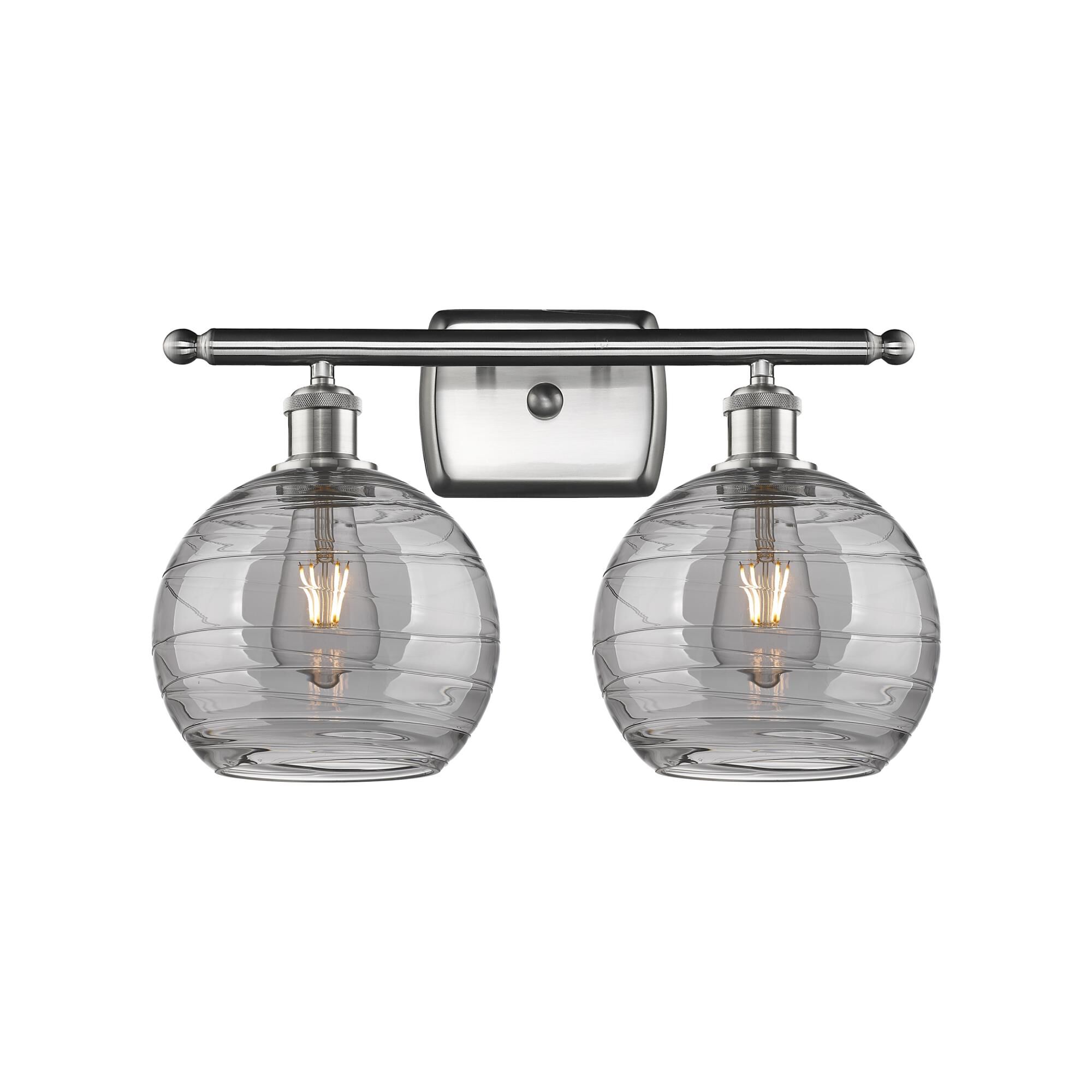 Shown in Brushed Satin Nickel finish and Light Smoke Deco Swirl glass