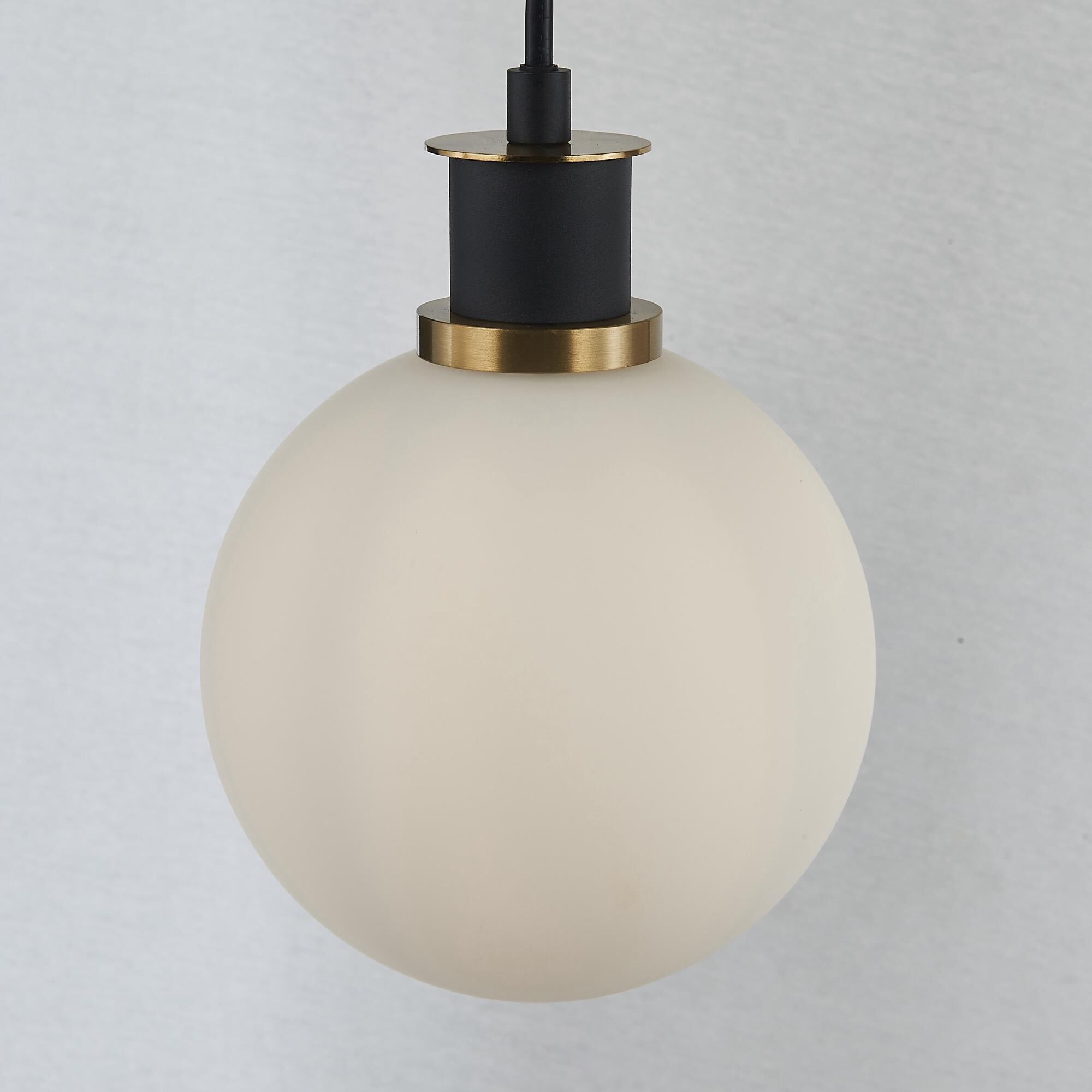 Shown in Black and Brushed Brass finish and White glass