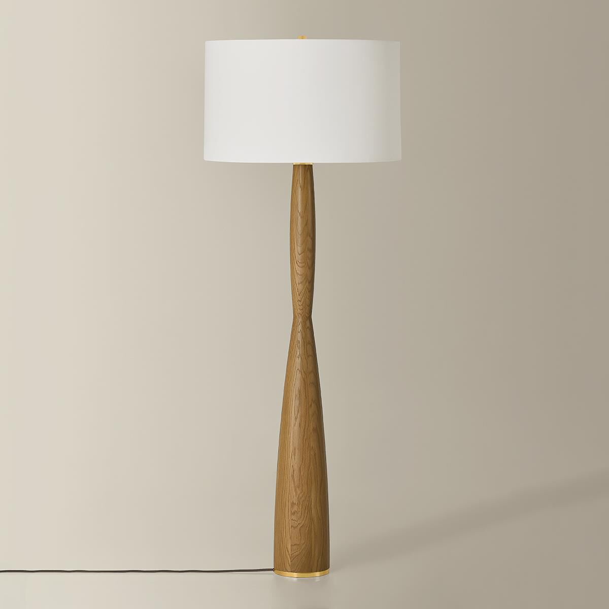 Shown in Aged Brass finish and White Linen shade
