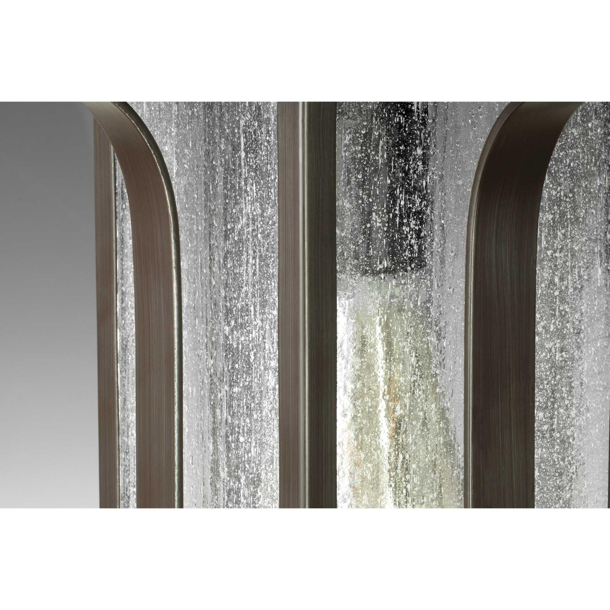 Shown in Antique Bronze finish and Clear Seeded glass