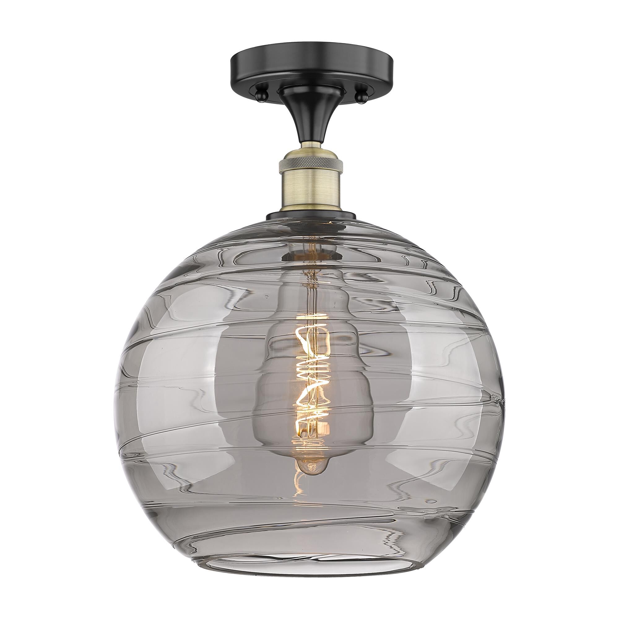 Shown in Black Antique Brass finish and Light Smoke Deco Swirl glass