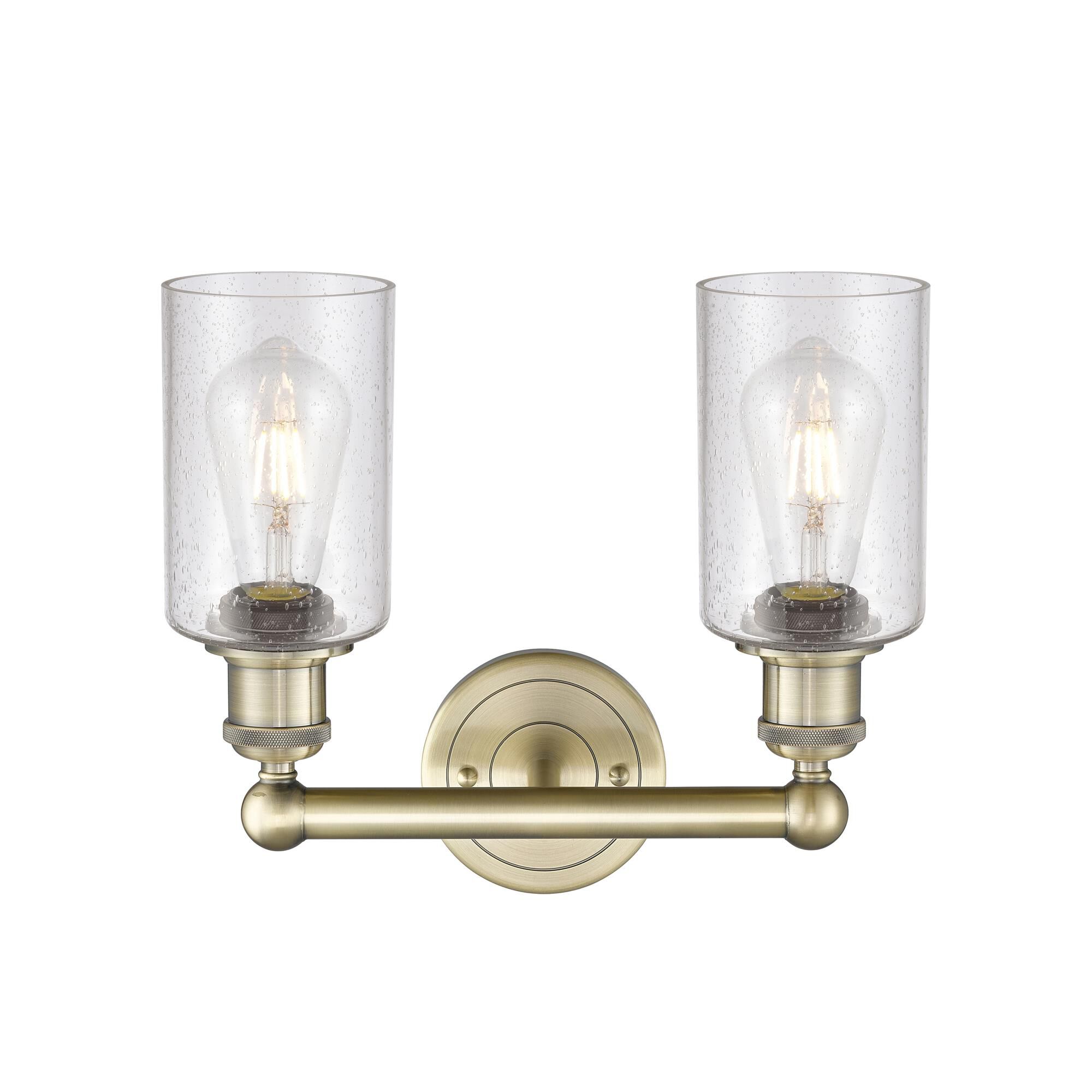 Shown in Antique Brass finish and Seedy glass