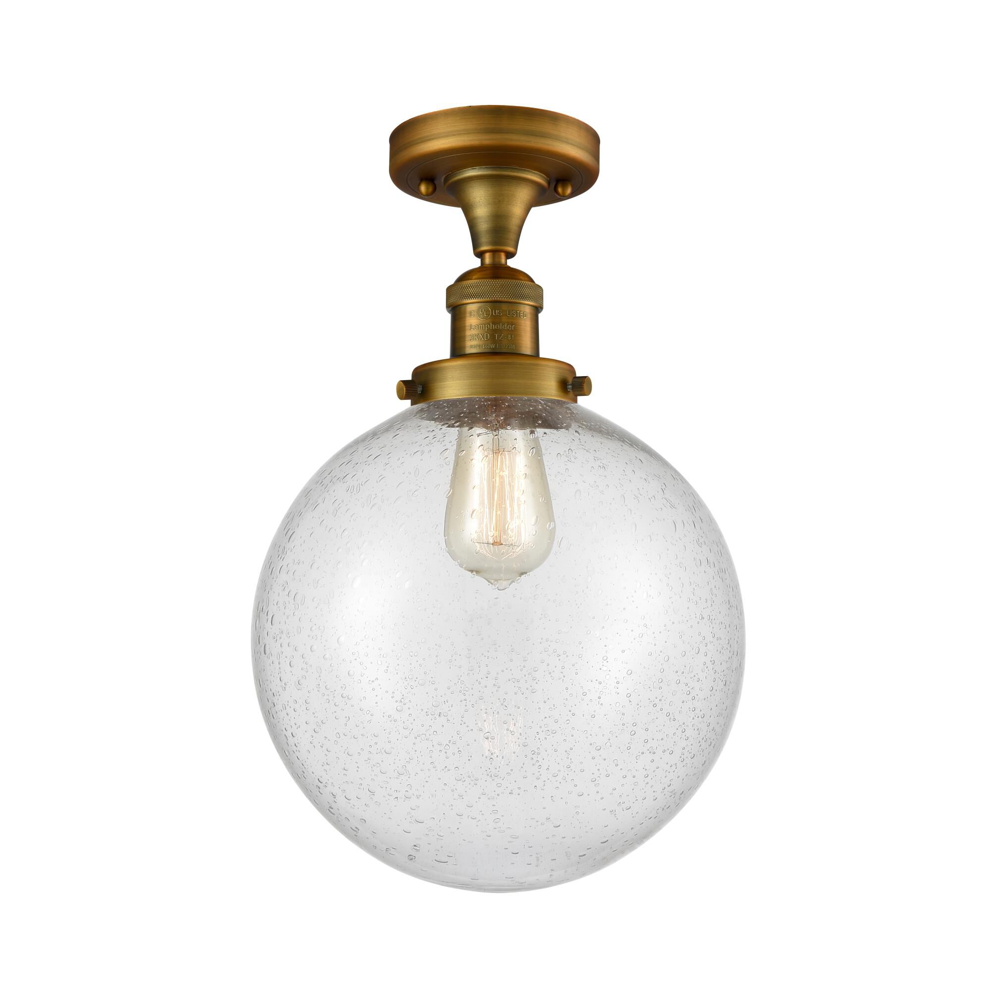 Shown in Brushed Brass finish and Seedy glass