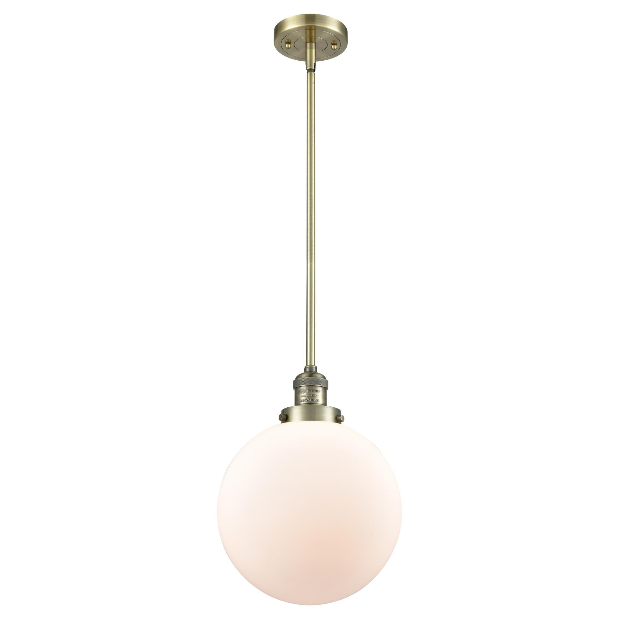 Shown in Antique Brass finish and Matte White Cased glass