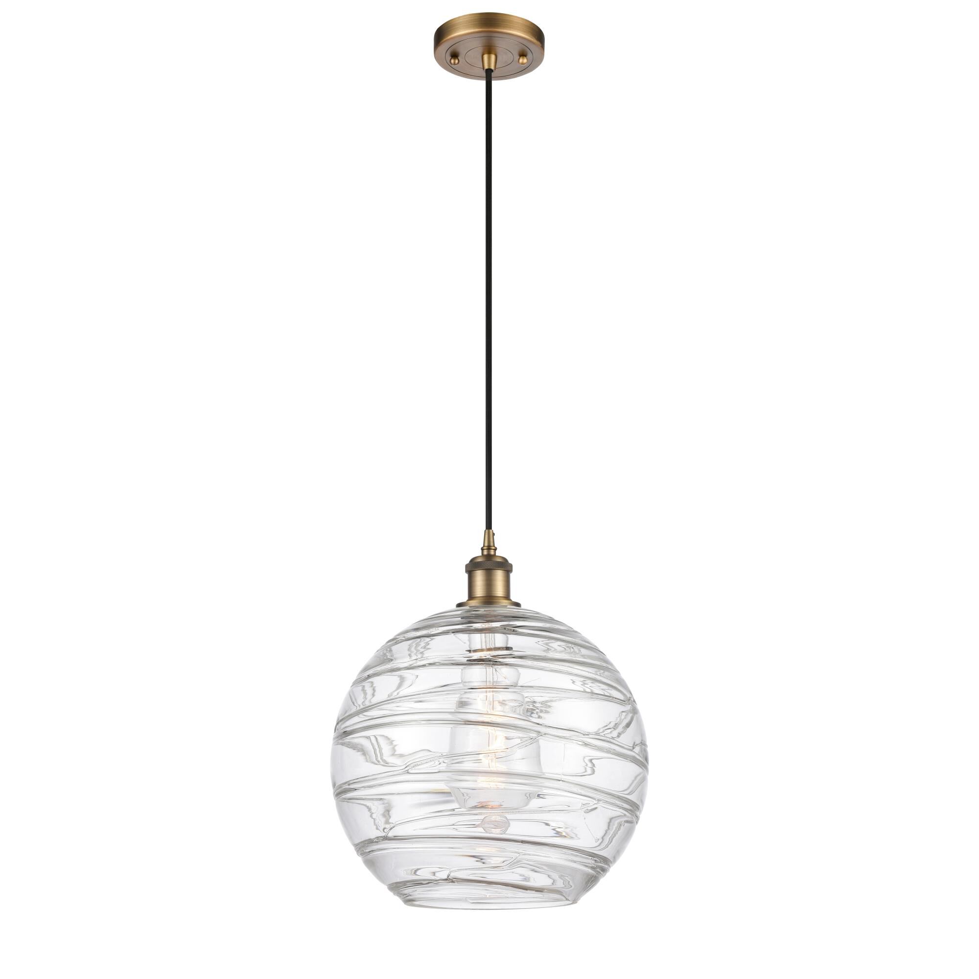 Shown in Brushed Brass finish and Transparent Deco Swirl glass