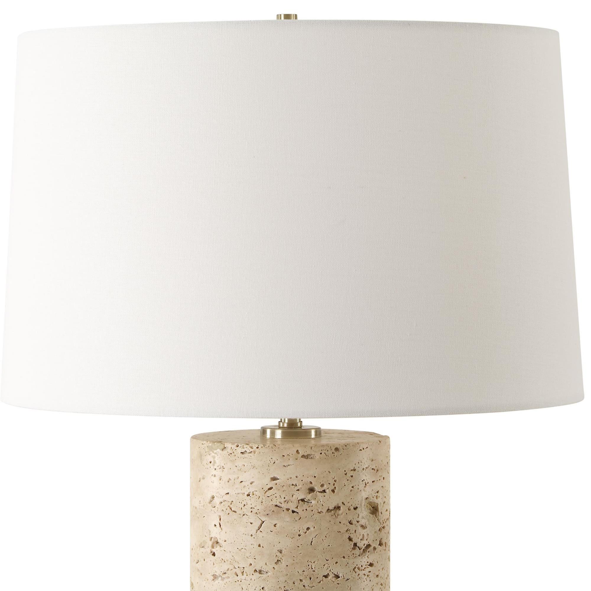 Shown in The Aubrey Table Lamp Harmonizes Natural Beauty With Classic Elegance. Crafted From Travertine, Its  finish and Round Hardback shade