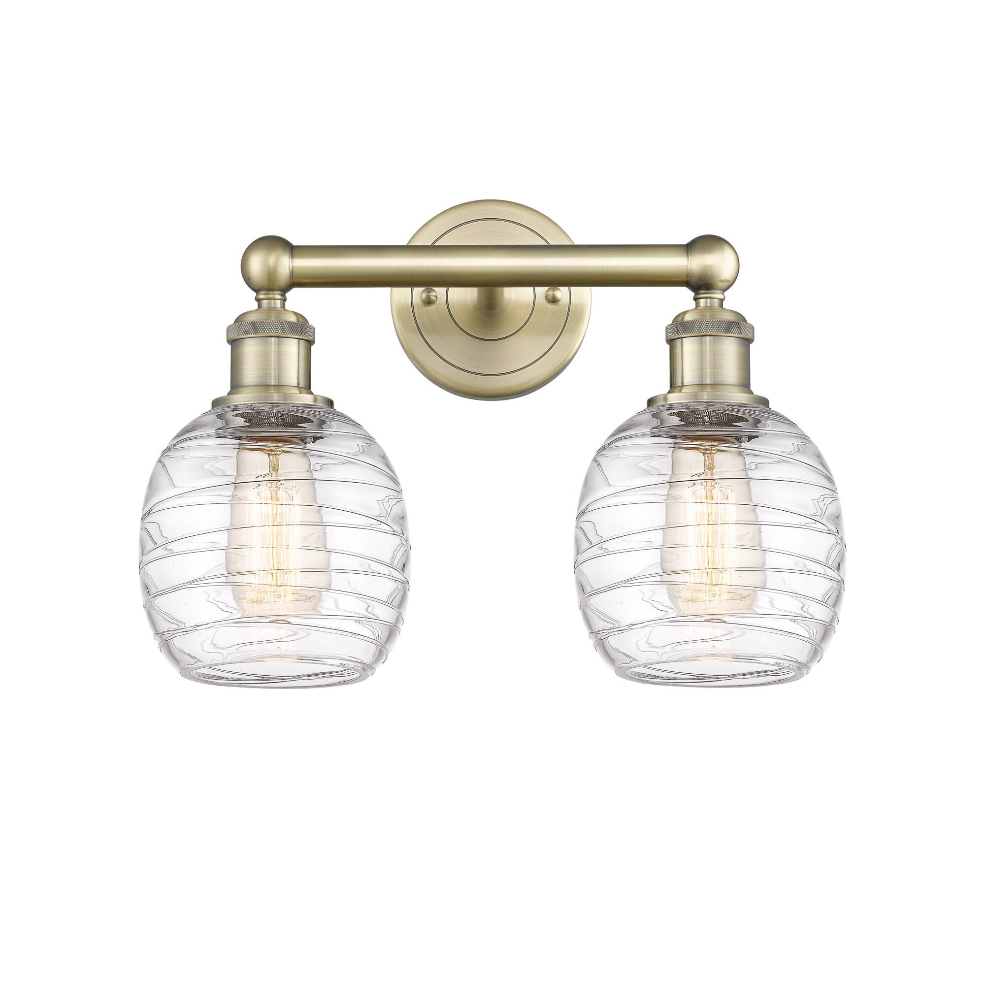 Shown in Antique Brass finish and Deco Swirl glass