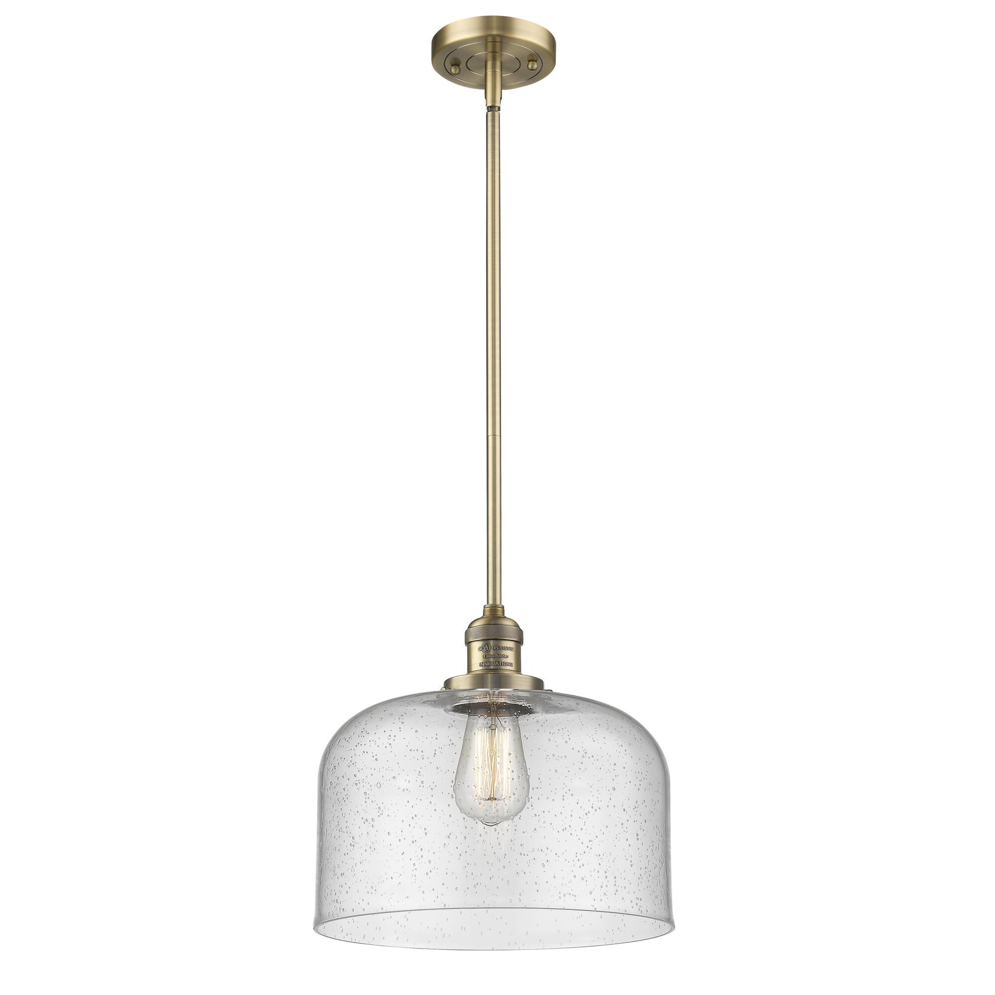 Shown in Brushed Brass finish and Seedy glass